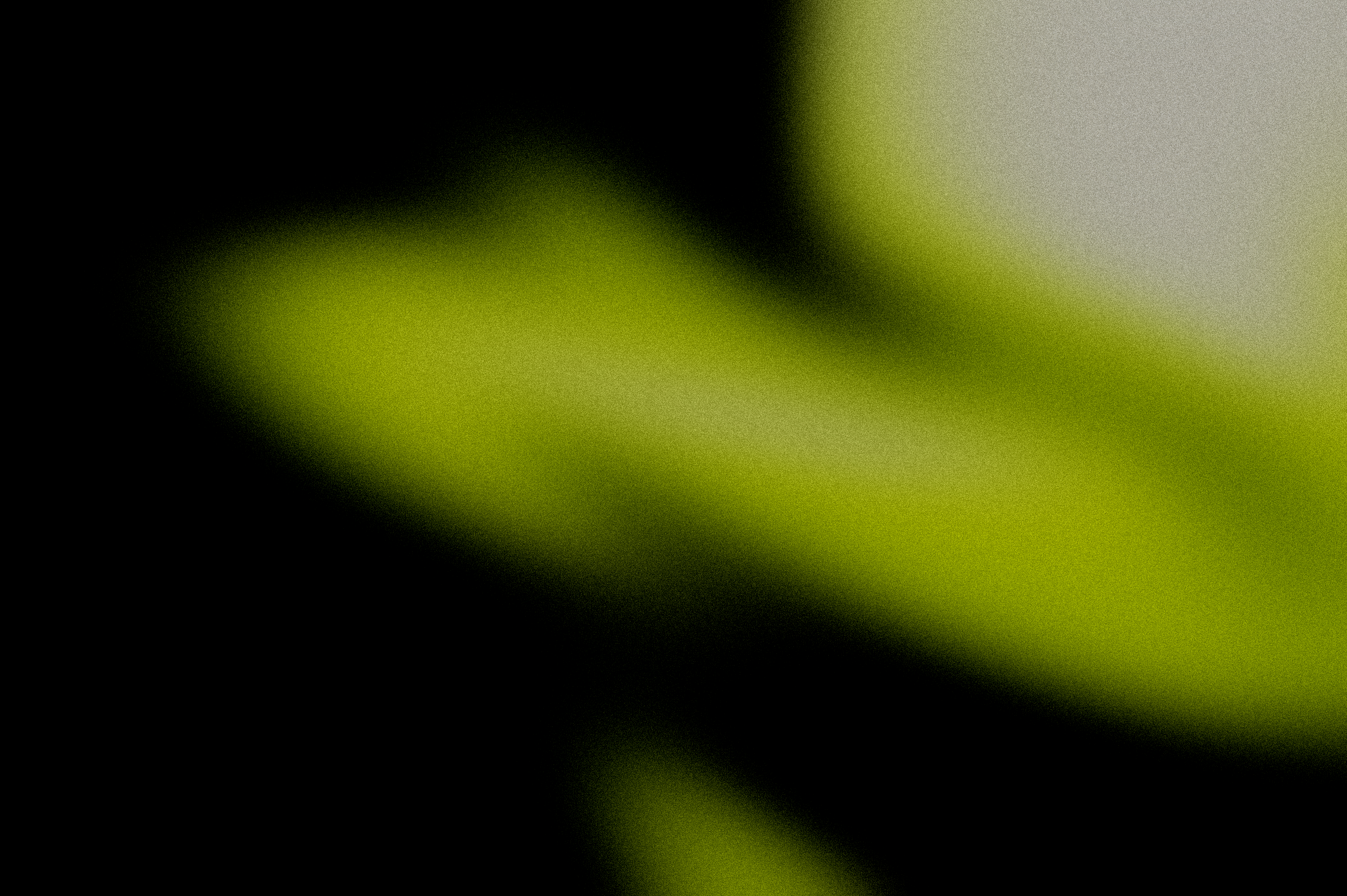 An extreme close-up of a green lime with a blurred background.