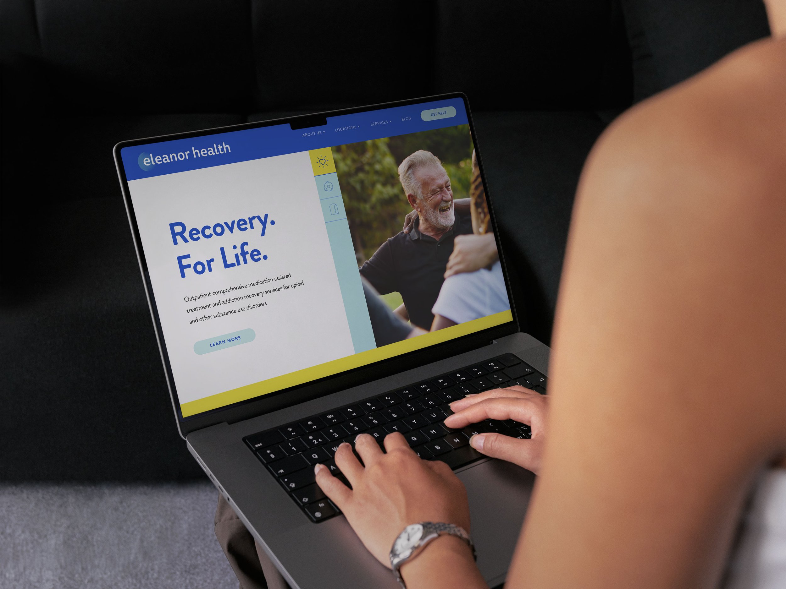 Person browsing Eleanor Health website on laptop, showing a recovery program for opioid and substance use disorders, with a photo of smiling older man outdoors.