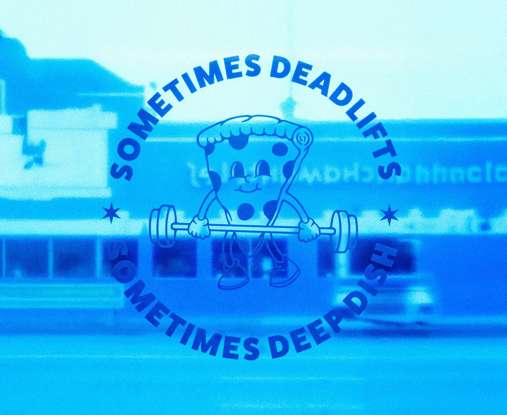 Store window decal for Above the Bar Chicago with the text 'Sometimes Deadlift, Sometimes Deep Dish' surrounding it.