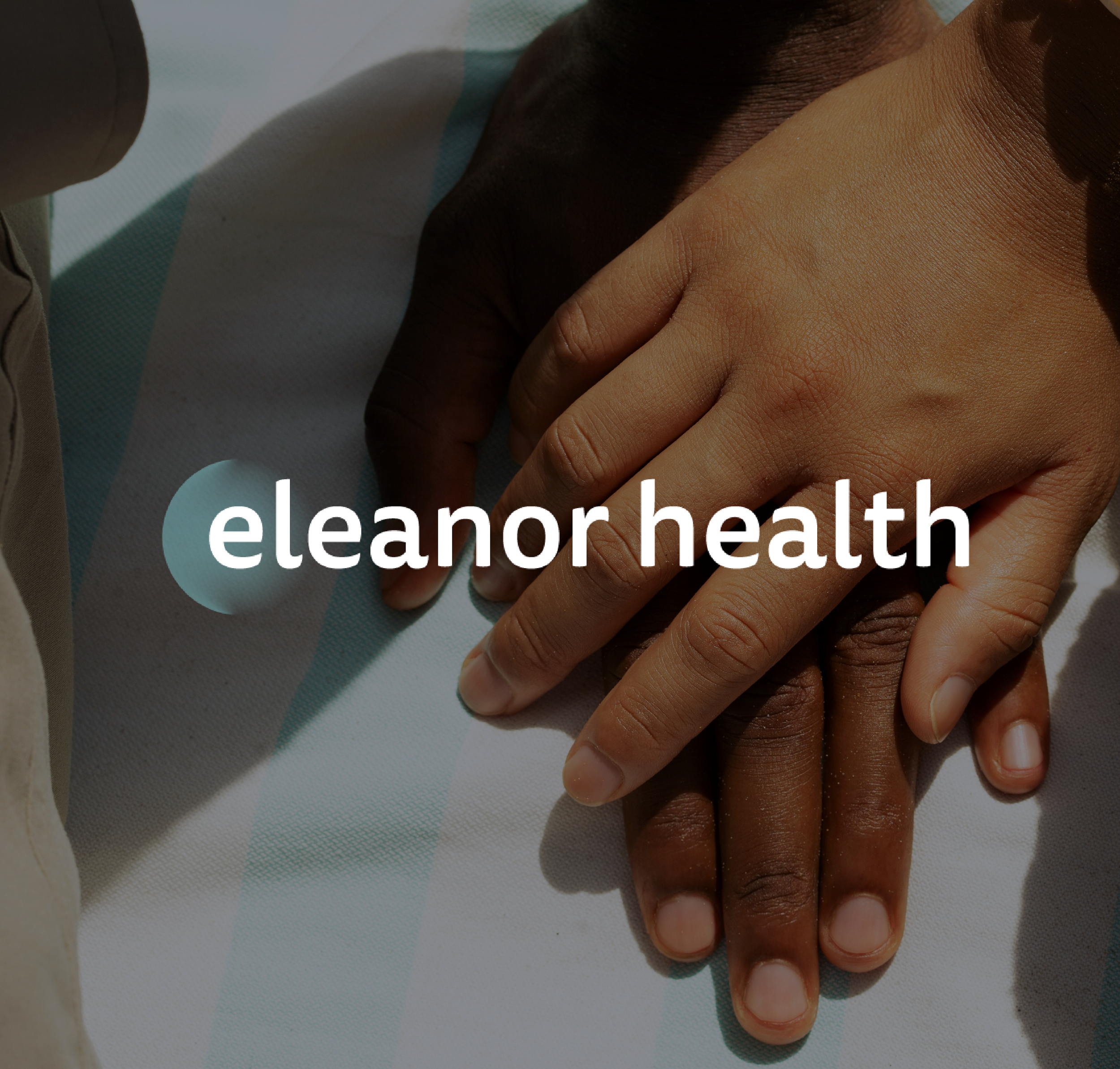 A close-up of two hands, one darker-skinned, the other lighter-skinned, resting on a medical tray or surface, symbolizing healthcare and unity. The text 'eleanor health' is overlaid on the image.