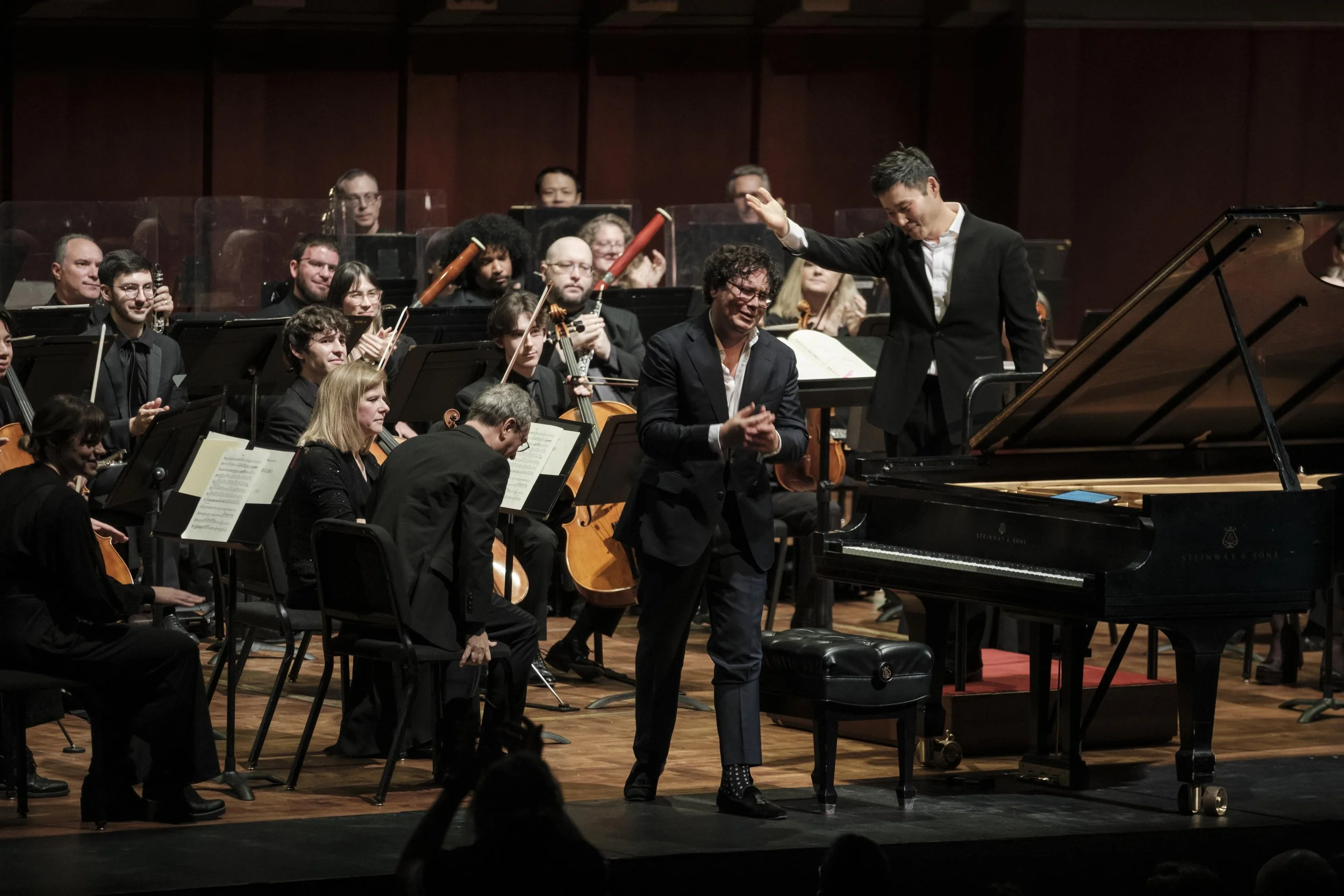 Martin James Bartlett thanking the audience from the stage after performing during a concert with the Ann Arbor Symphony Orchestra.
