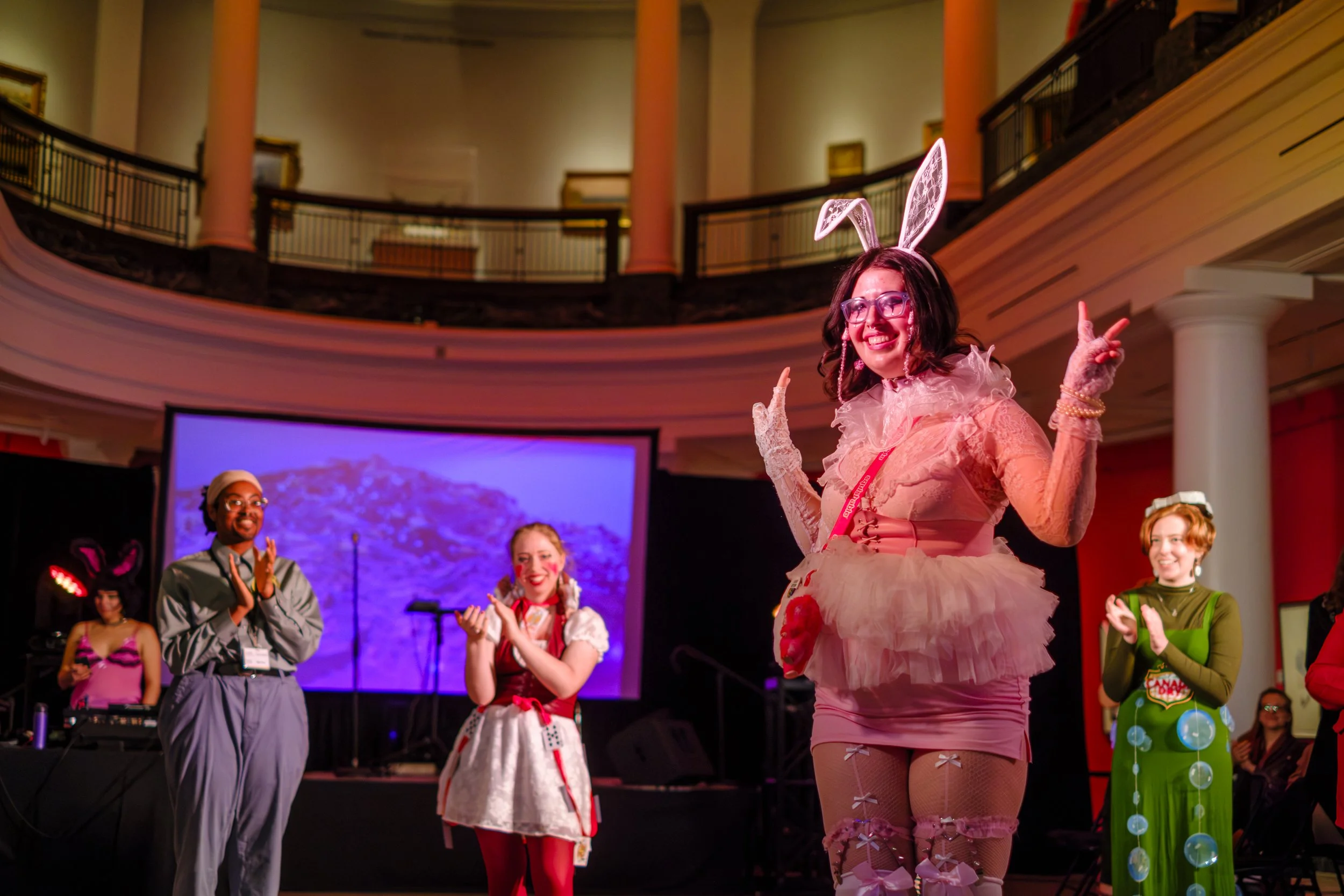 A person throws up peace signs while in their Halloween costume as part of the University of Michigan Art Museum Halloween Feel Good Friday Celebration in Ann Arbor, MI