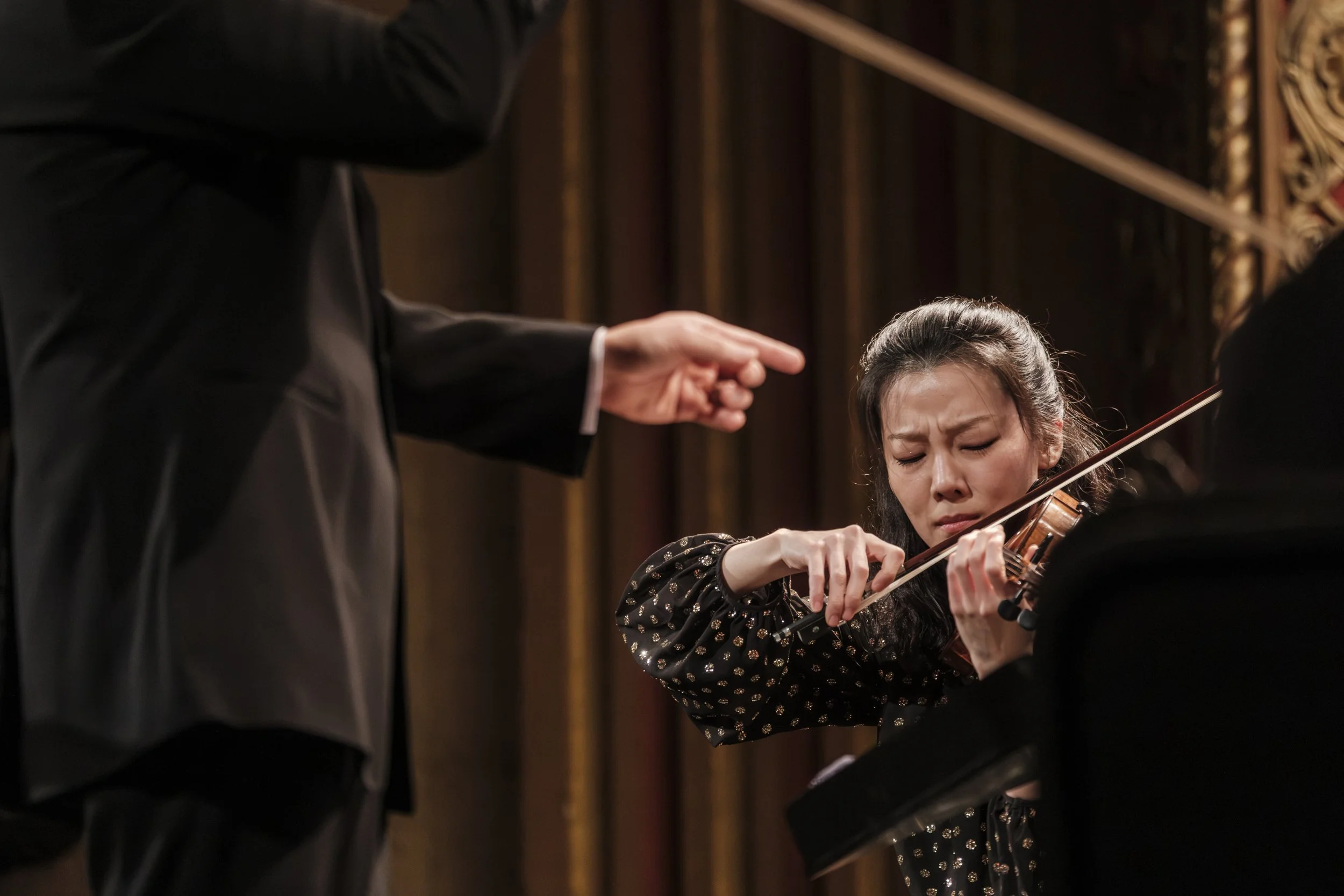 Violinist Clara-Jumi Kang performing during a concert for the Ann Arbor Symphony Orchestra.