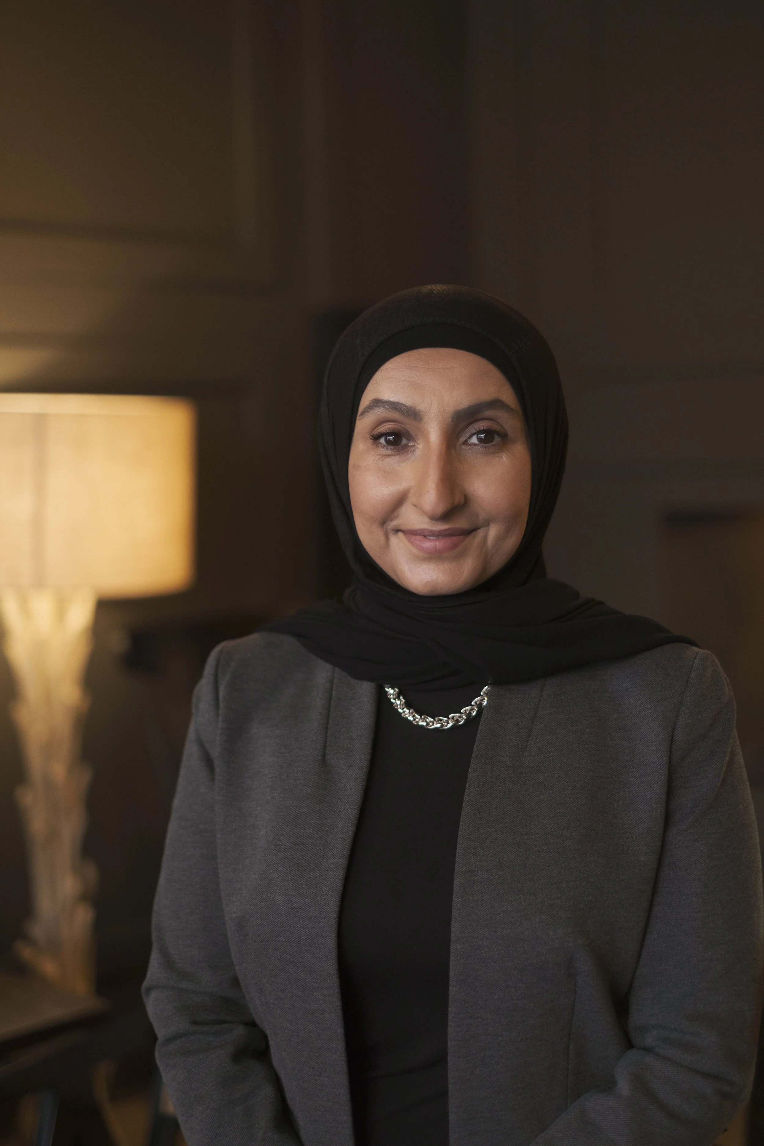 A headshot of a women in a hijab taken in Dearborn Michigan by Michigan Editorial Portrait Photographer Charlotte Smith