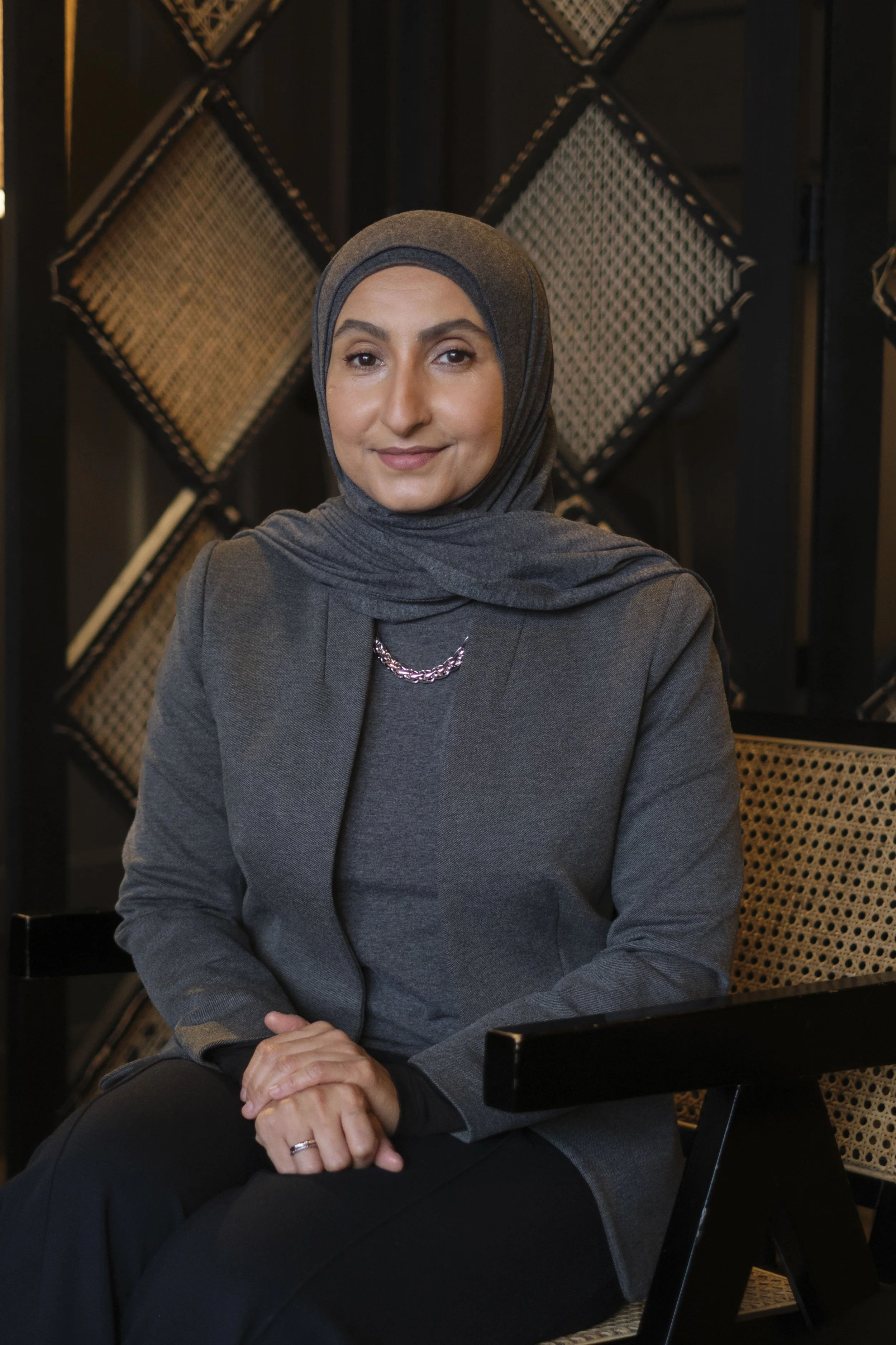 A headshot of a women in a hijab taken in Dearborn Michigan by Michigan Editorial Portrait Photographer Charlotte Smith