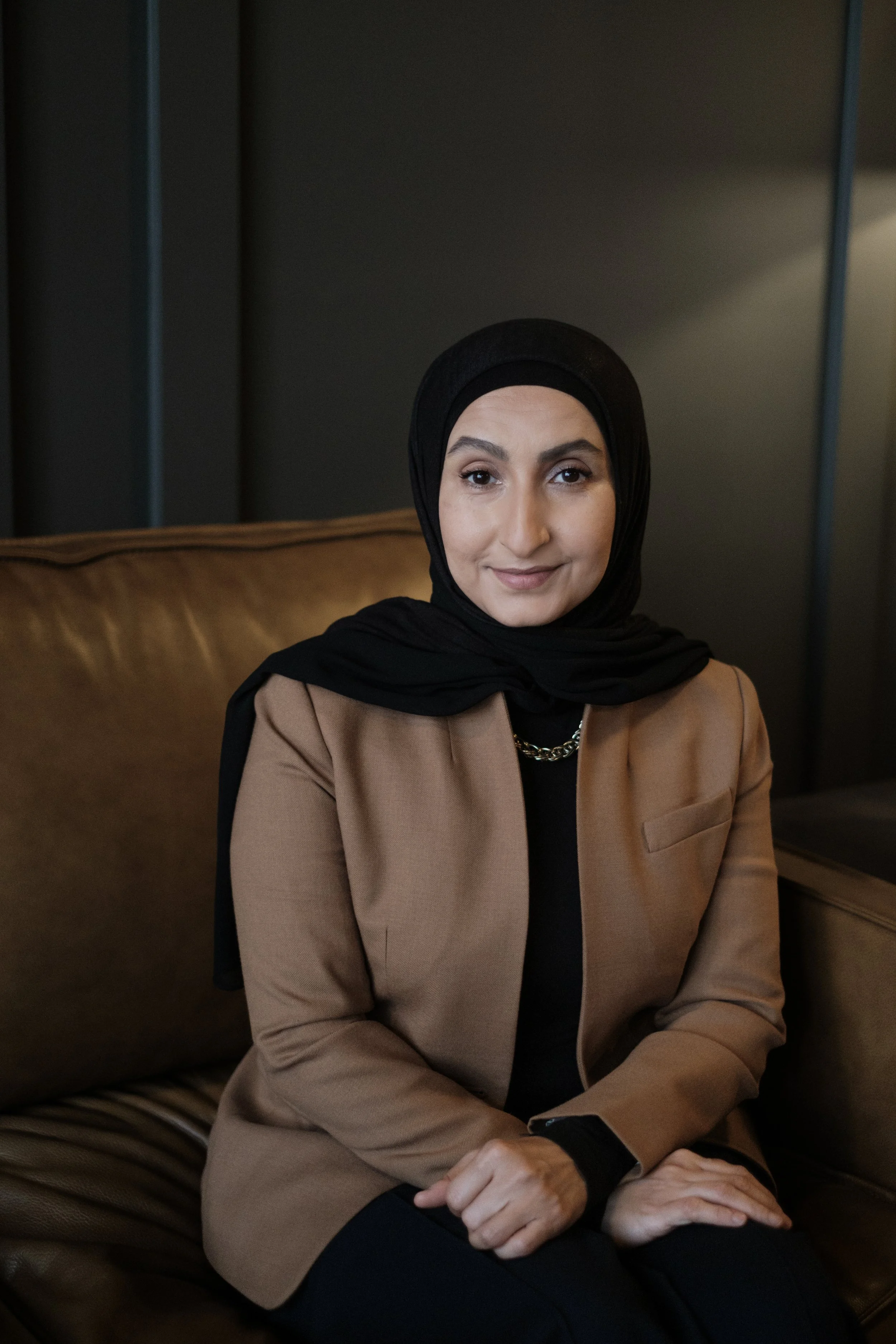 A headshot of a women in a hijab taken in Dearborn Michigan by Michigan Editorial Portrait Photographer Charlotte Smith