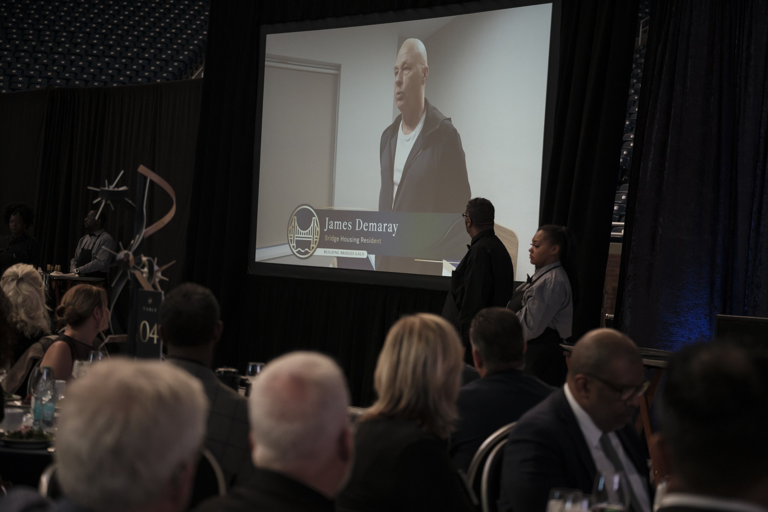 A screen showing an interview with a man.