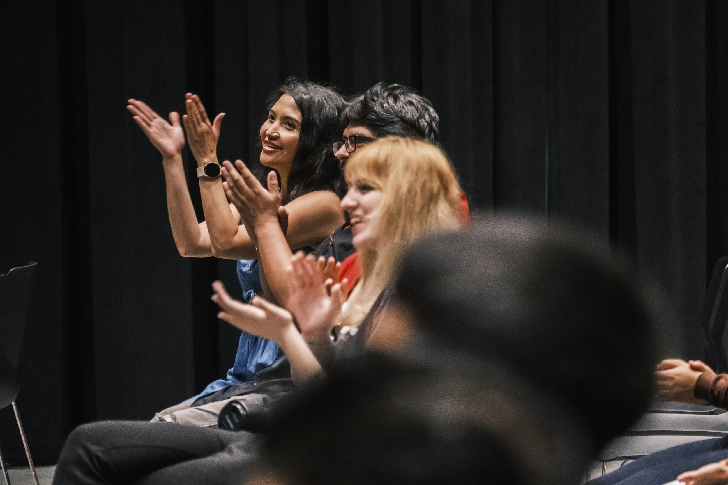 Guests cheer and applaud during MiHC’s Gran Fiesta in Detroit.