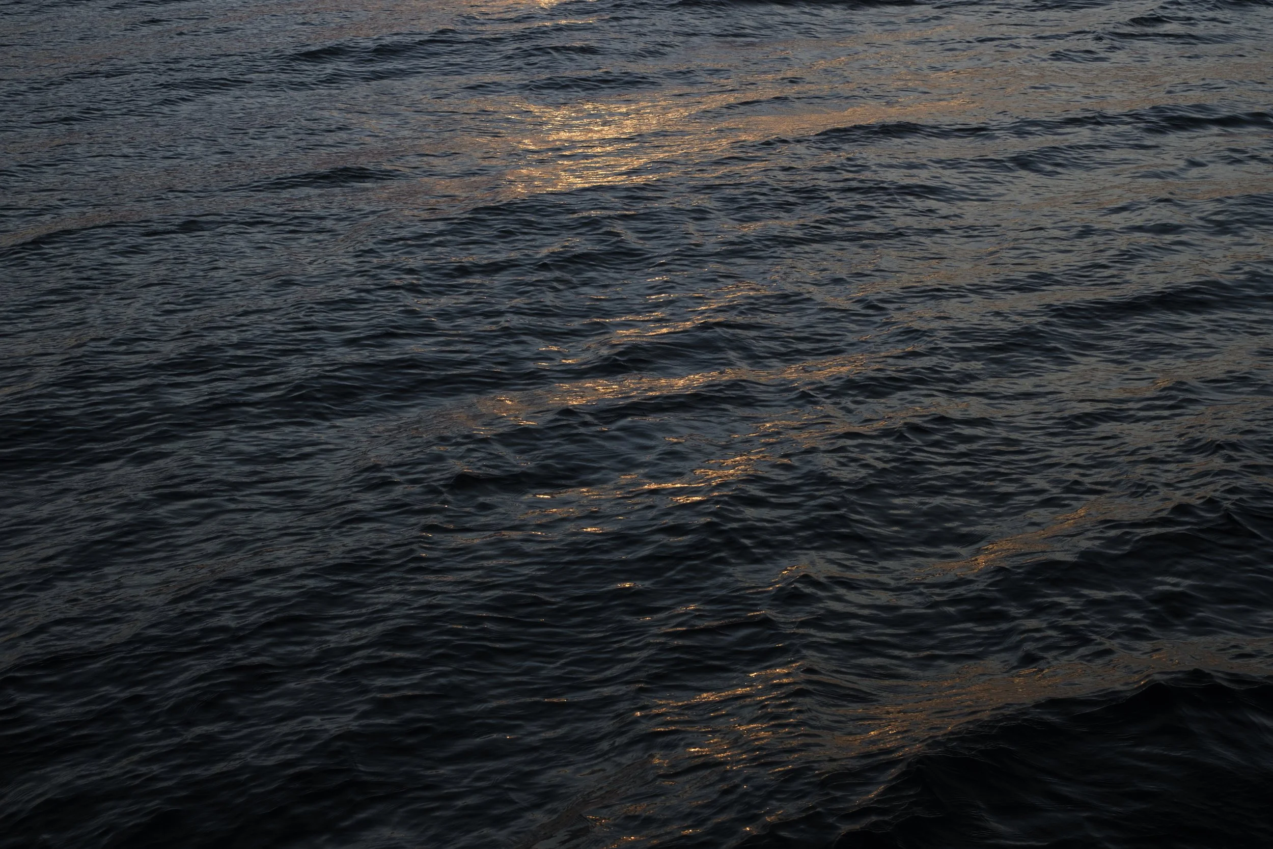 Light from a sunset reflecting on the waters of Lake Superior