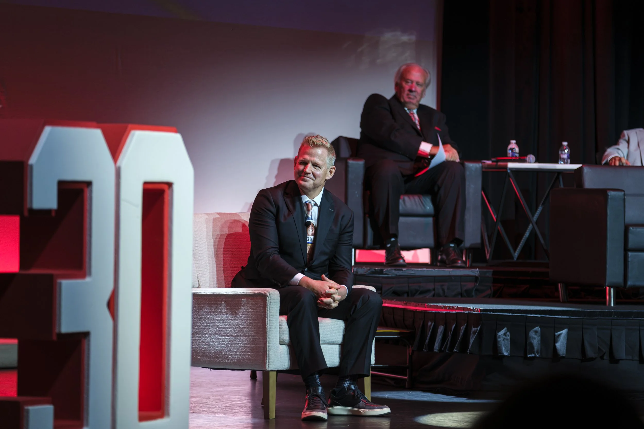 Retired Red Wings goalie Chris Osgood smiles while sitting onstage during the Roast of Chris Osgood, raising funds for the Jamie Daniels Foundation.
