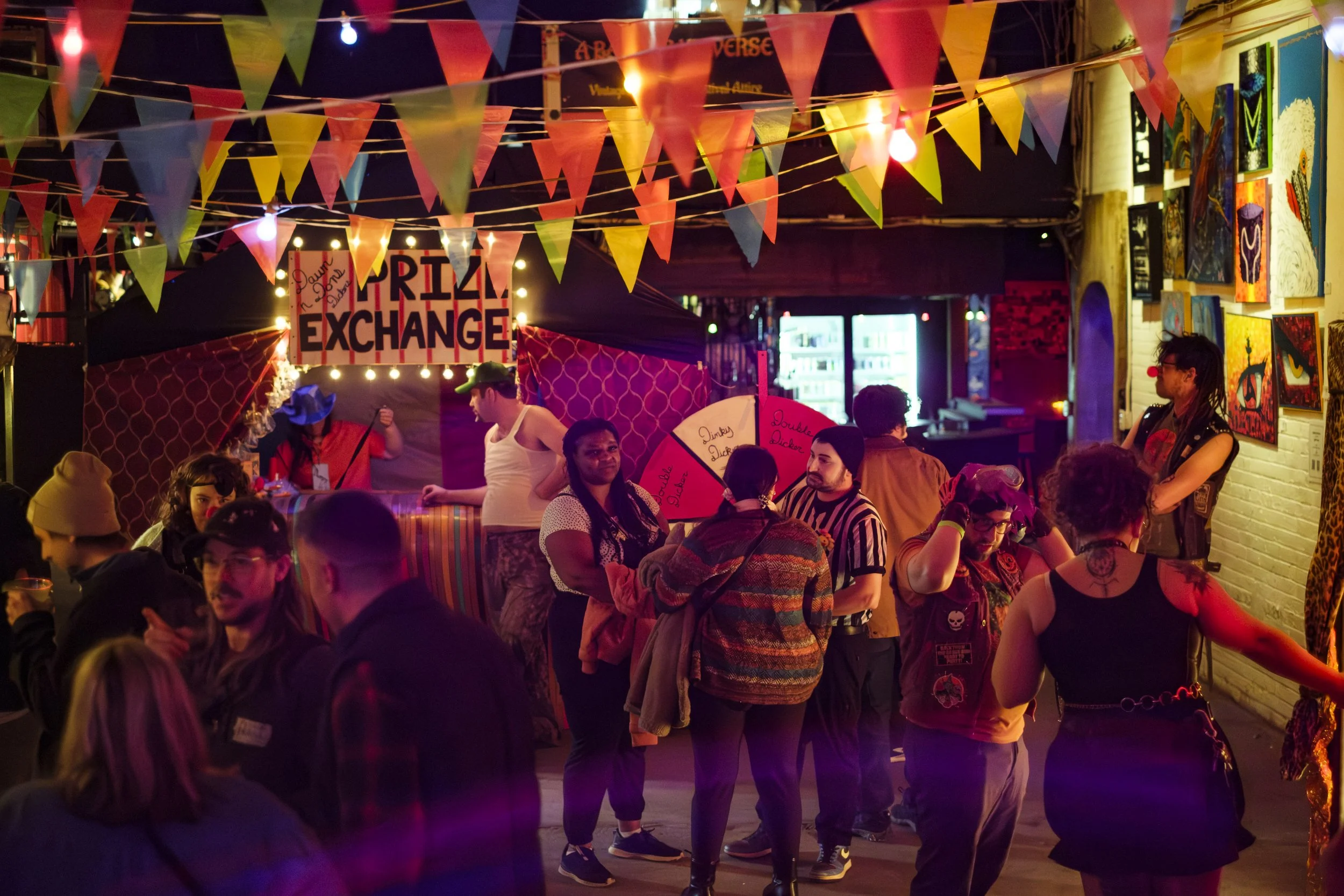 A crowd of people attend the Dumpy Dicker Ypsitucky Travelin' Carnival before the start of the CLOWN Wrestling Big Top Brawl.