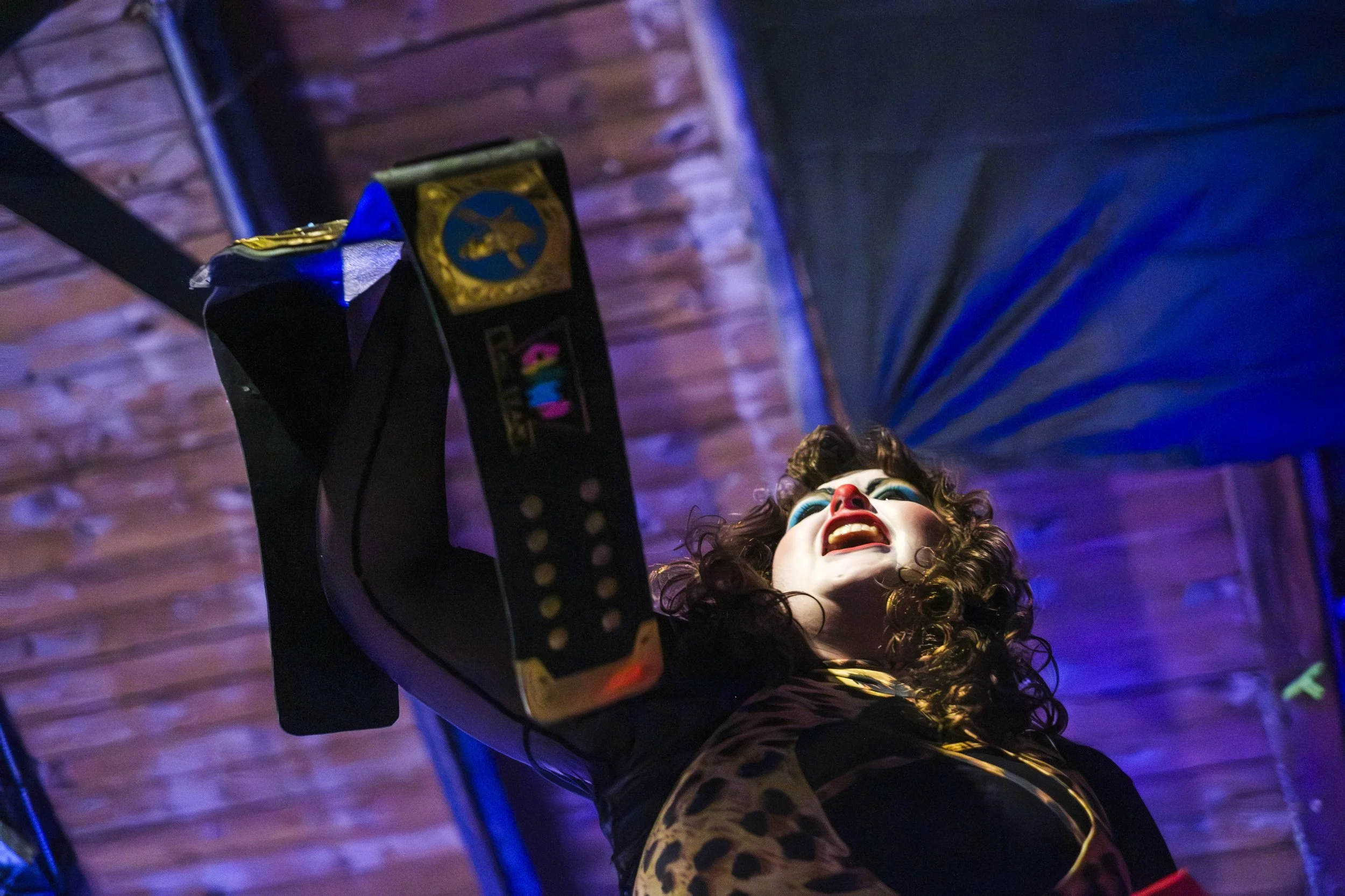 Clown wrestler Julia Guilia, one of the members of the Knights of Seaside Heights, holds the championship belt after winning the Prat Fall Pals Clown Car Match.