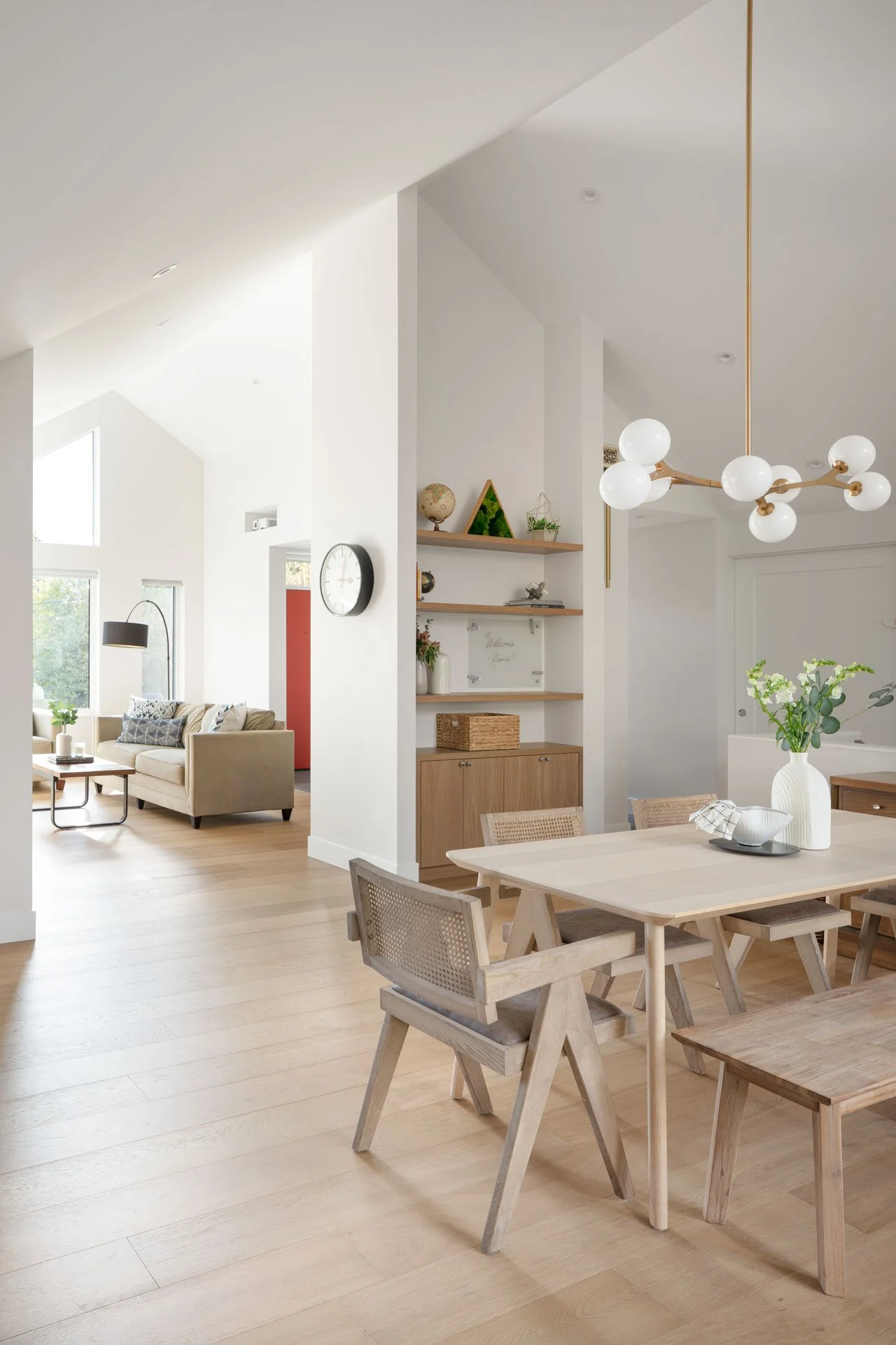 Vertical shot of bright living and dining room renovation at Greylynn Crescent, North Vancouver - architectural interior photogprahy 