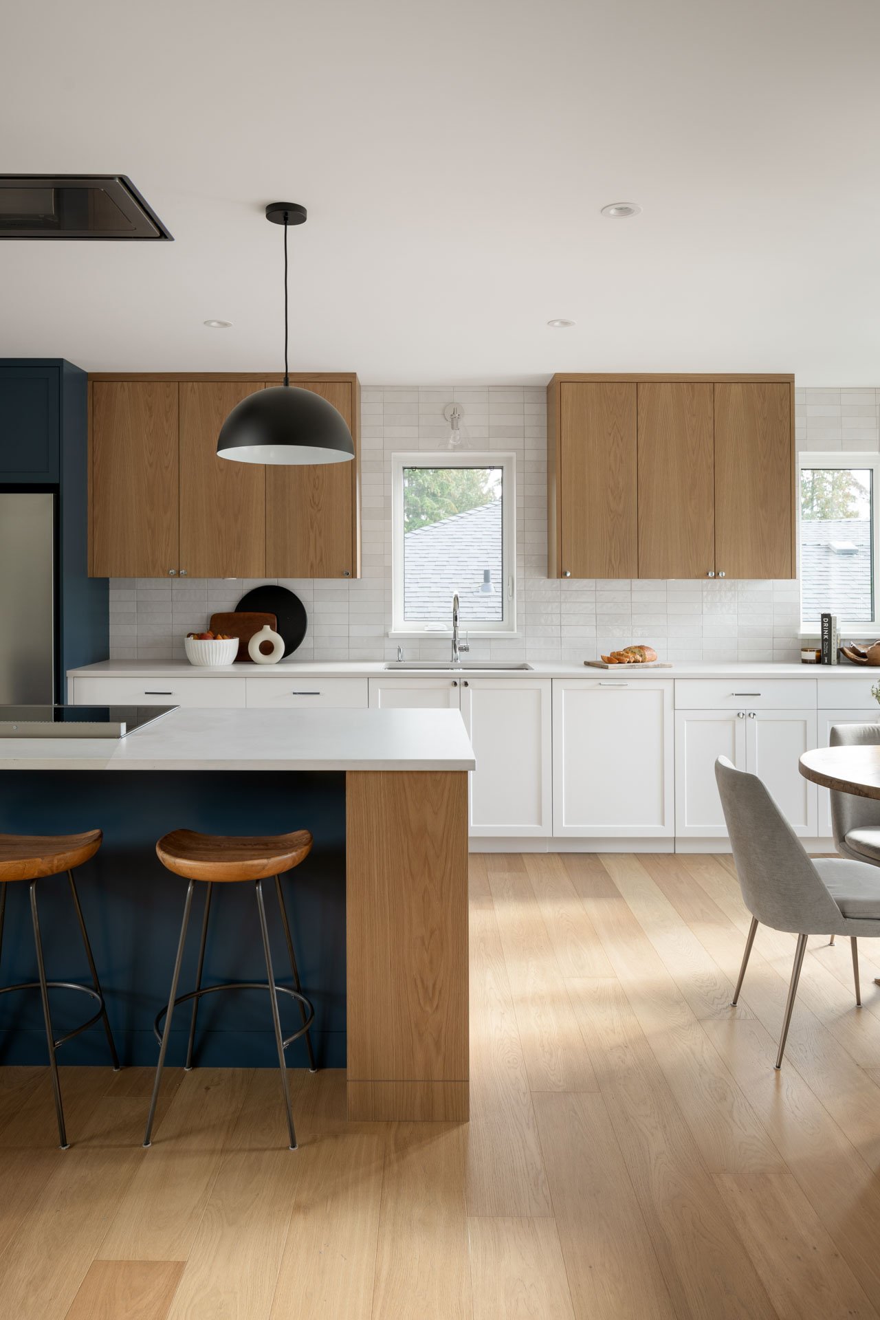 Architectural photography of kitchen and dining room in North Vancouver home. Interior design by Triple Dot Design Studio 