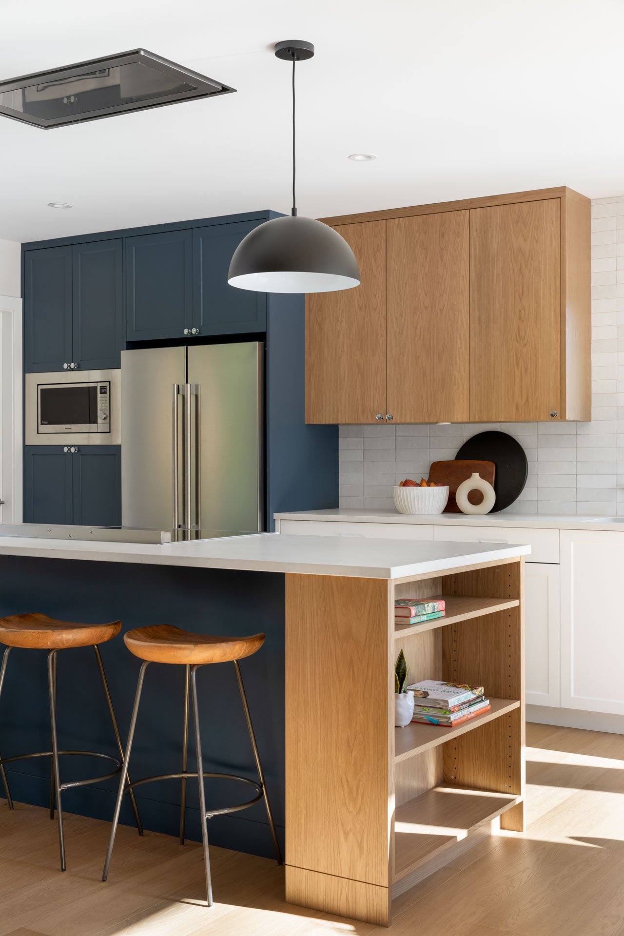 Architectural photography of kitchen renovation and dining room Greylynn Crescent. Interior design by Cara Hansen at Triple Dot Design Studio 