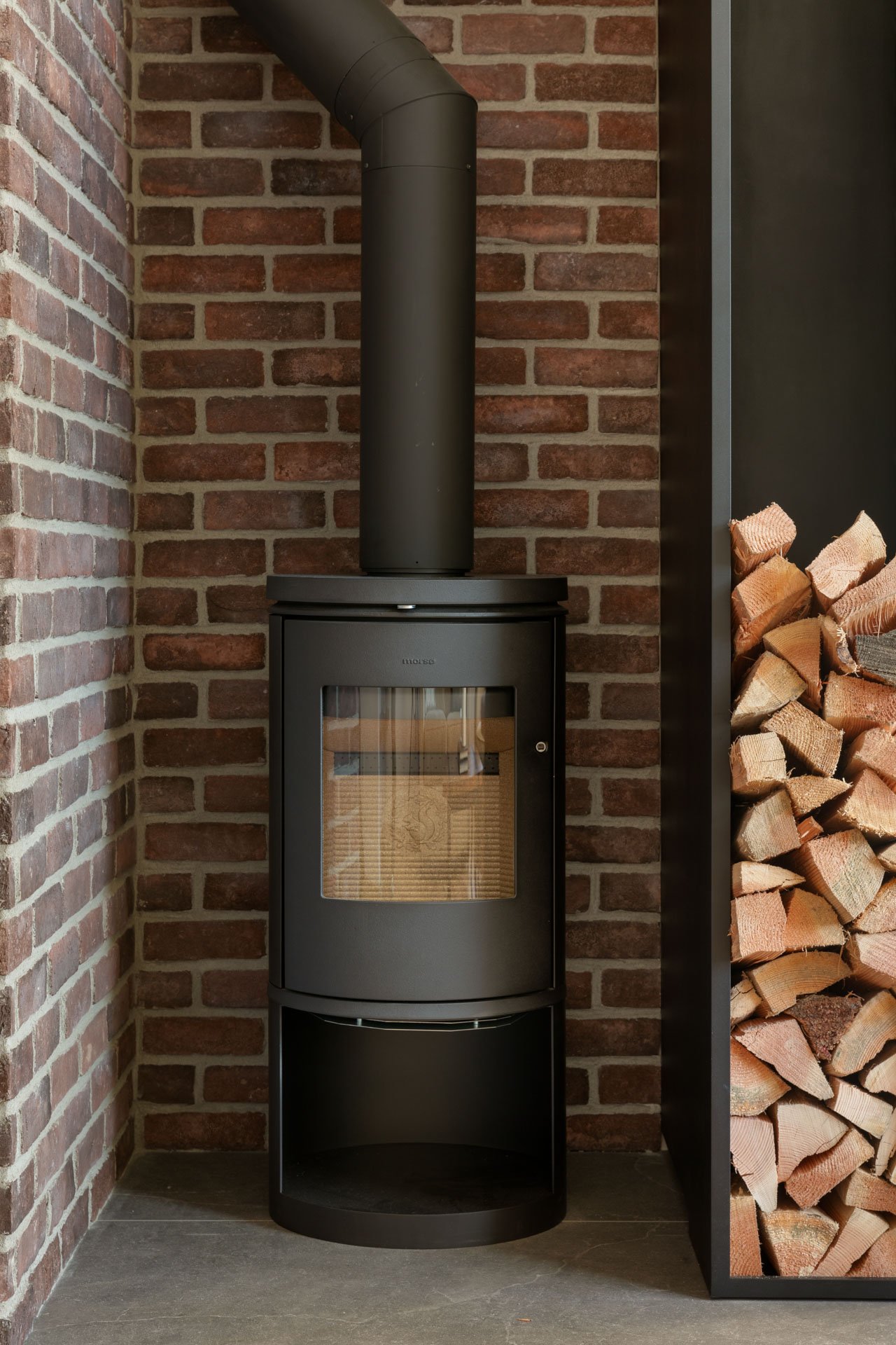 Detail shot of black wood-burning stove in North Vancouver home - interior photography 