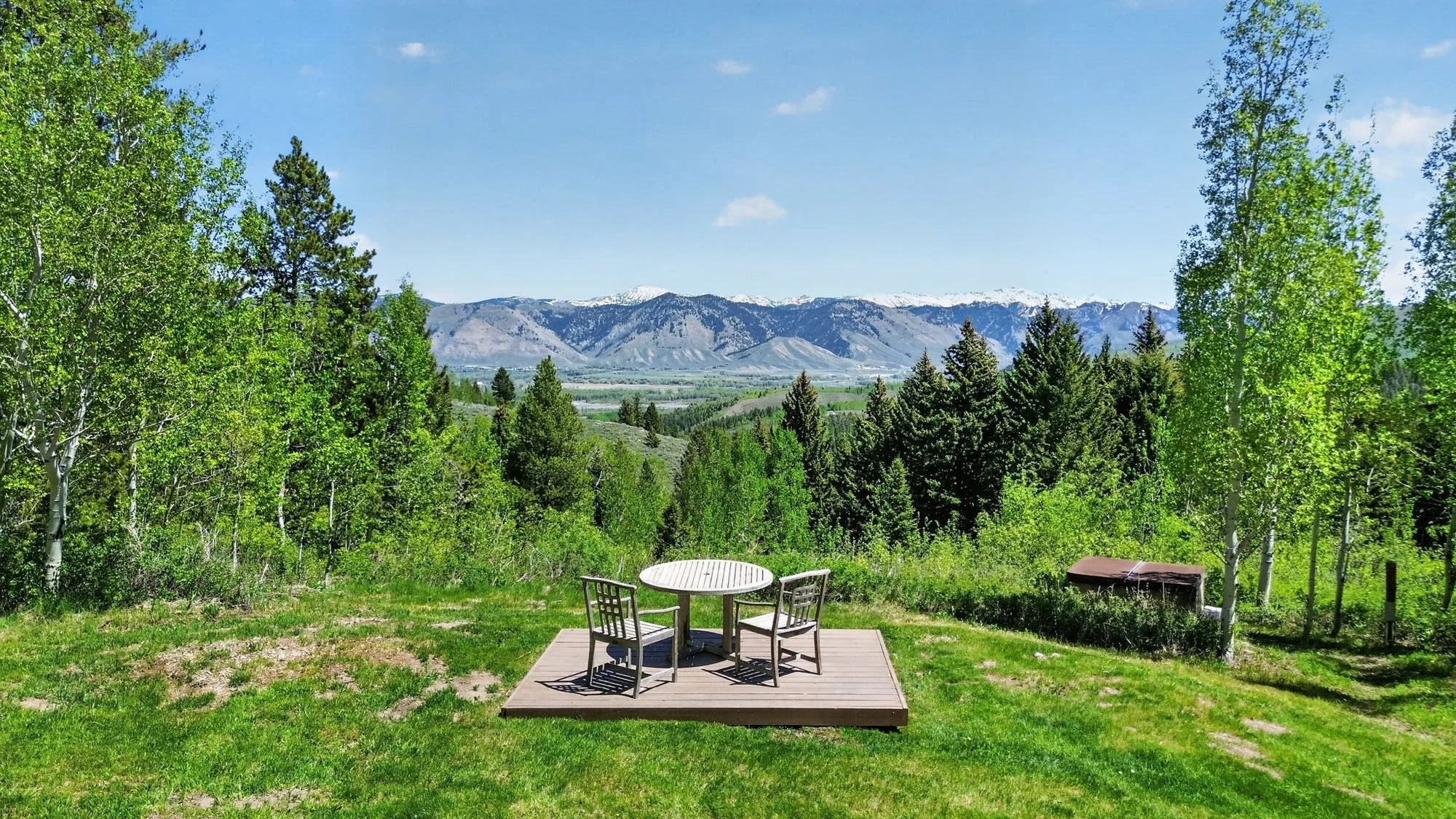 Picnic table on a deck overlooking the valley and mountains at Hidden Hills, Wilson, Wyoming