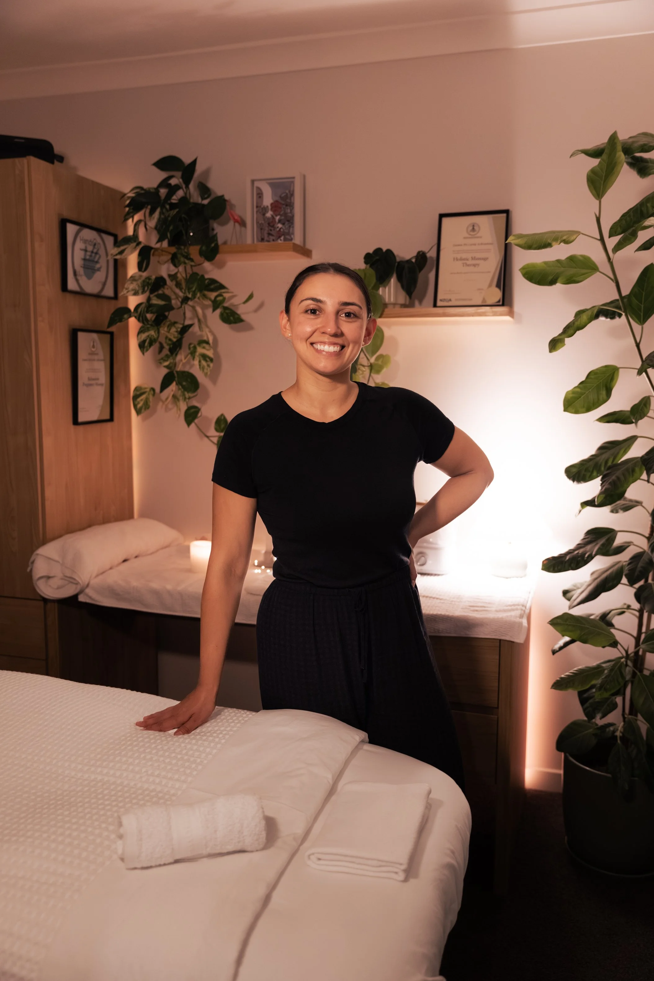 Luana, holistic massage therapist at New Moon Wellness Christchurch, in her treatment room