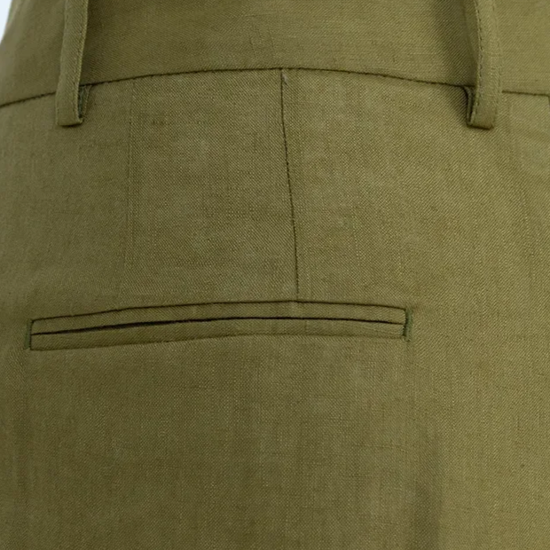 BIA LUCINA. womenswear Close-up of olive green dress pants with back pocket and belt loops.