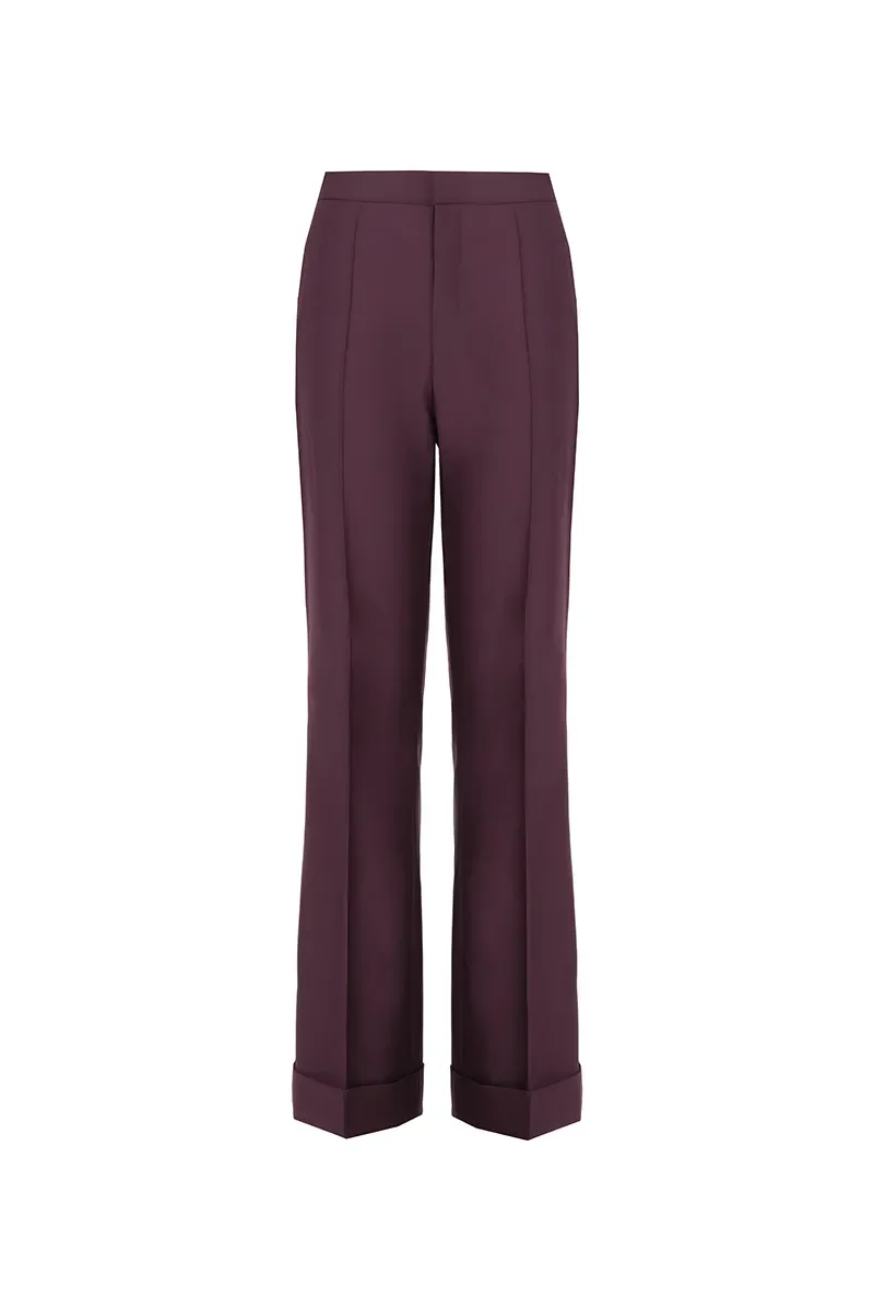A pair of maroon or burgundy tailored dress pants with a high waist and wide cuffed hems.