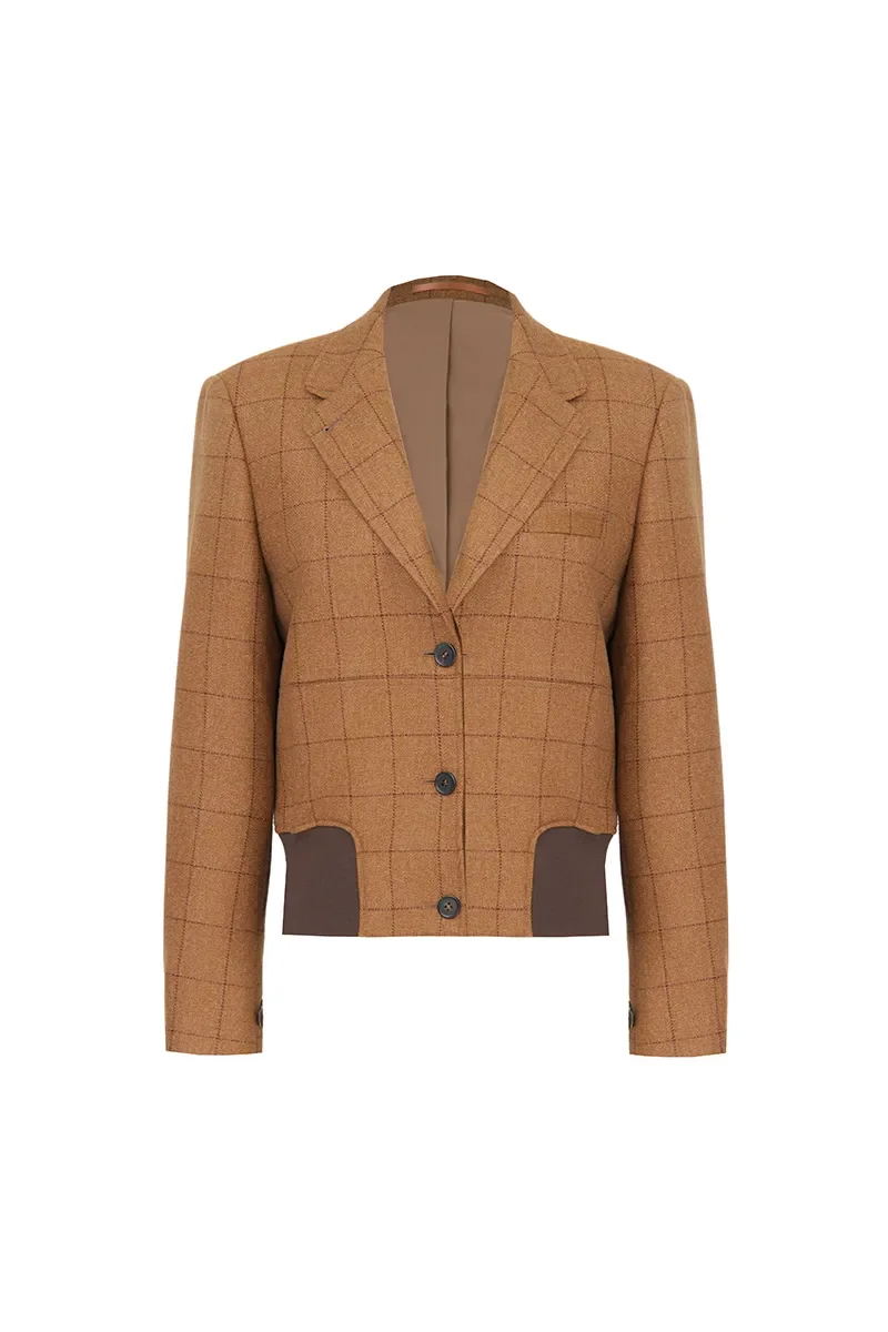 A brown plaid blazer with dark brown patches on the elbows and lower sides, featuring a notched lapel and three buttons down the front.