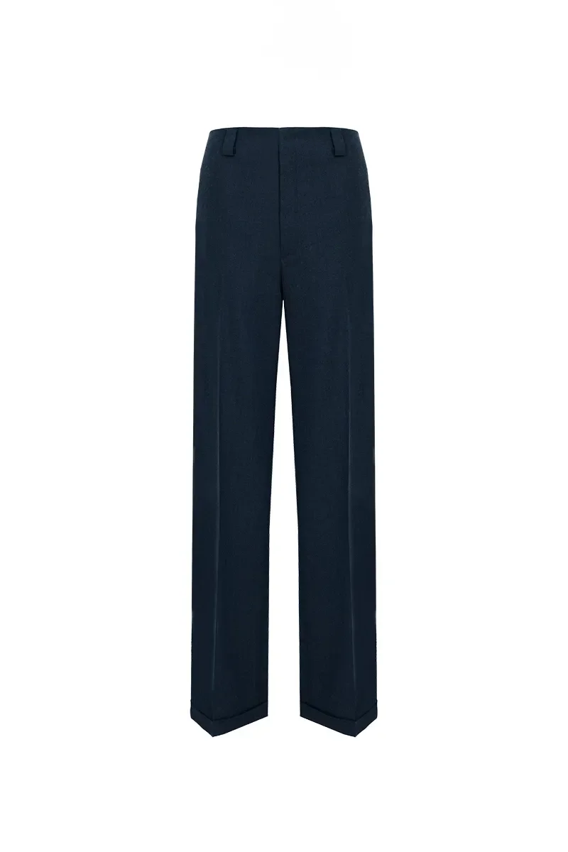 Dark blue tailored trousers with belt loops and a formal fit.