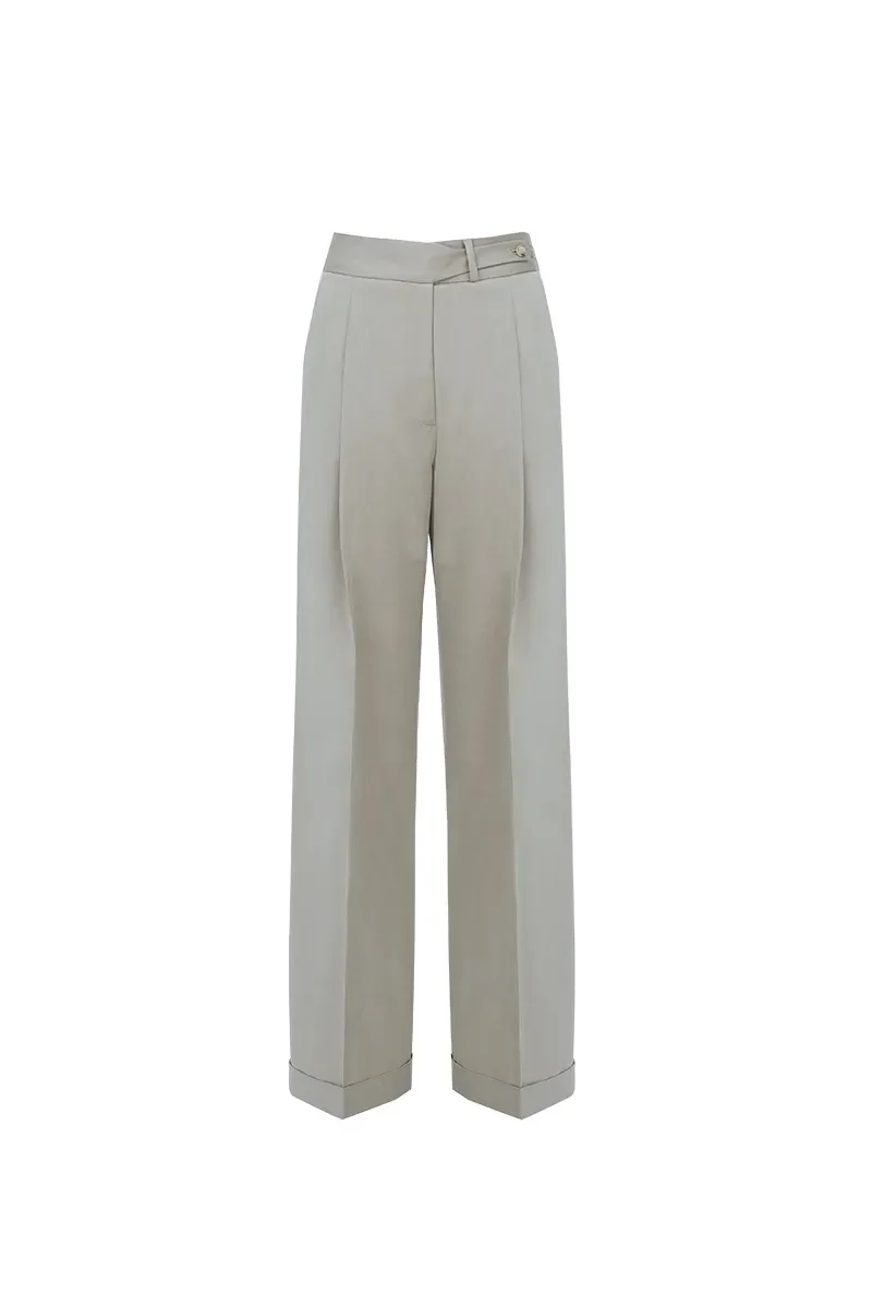 Light beige or cream-colored dress pants with a belt loop and a button waistband.