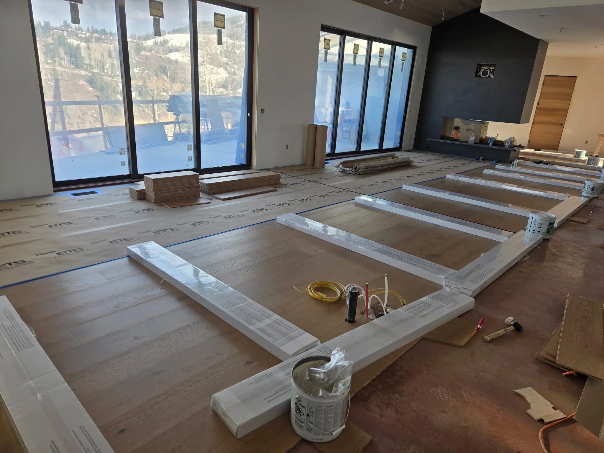Weighing down floor for proper adhesion 