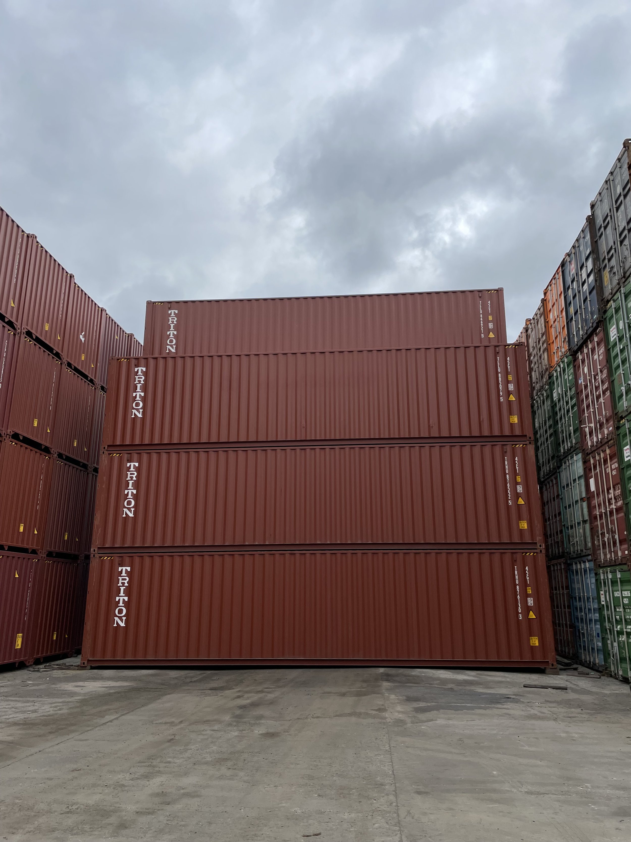 Stacks of 40FT High Cube One Trip Wind and Watertight shipping containers.