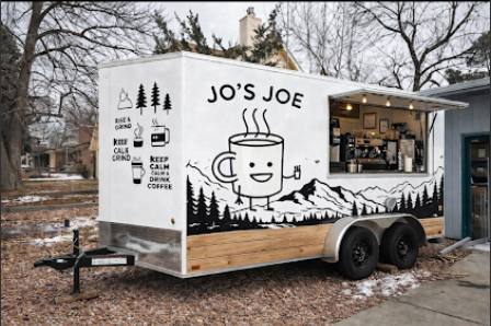 A white food truck with black illustrations and text, featuring a smiling coffee mug, trees, and mountains. The truck has a window with a barista inside preparing coffee. Text on the truck reads 'Jo's Joe' and phrases about coffee.