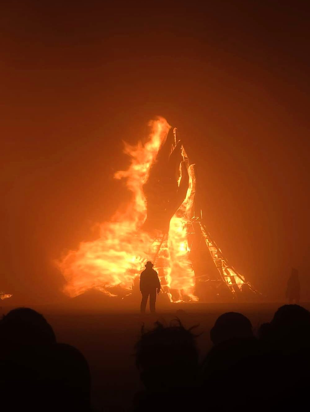 Temple of Together by Caroline Ghosn hands burning at Temple Burn with Sandman outlined by the flames