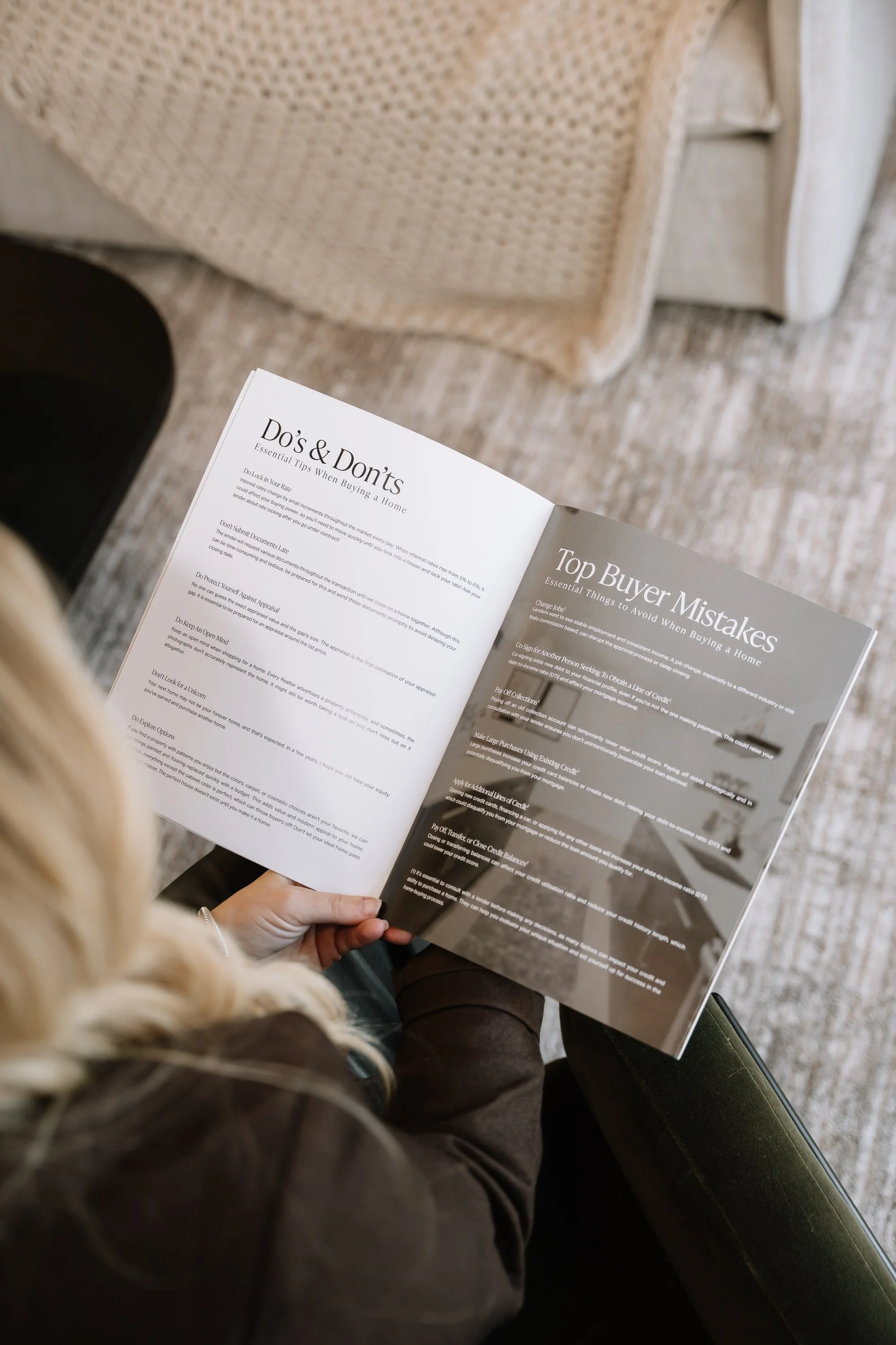 Person reading a magazine open to pages titled 'Do's & Don'ts' and 'Top Buyer Mistakes' in a cozy room with a beige woven chair and carpet.