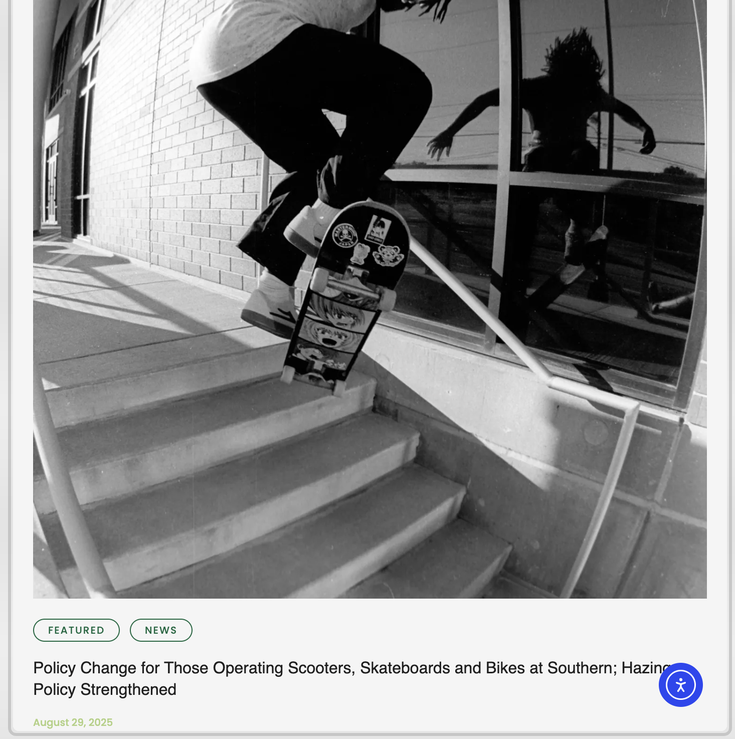 A skateboarder performing a trick on a staircase outside a building, reflected in a large glass window.