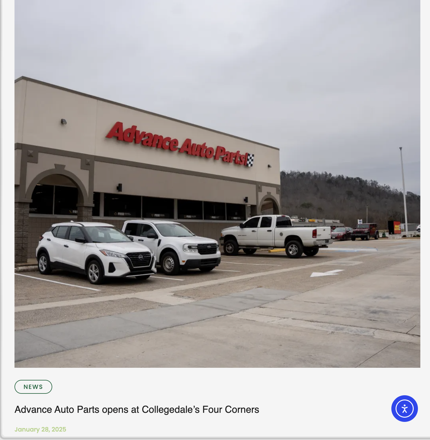 Photo of a parking lot in front of an Advance Auto Parts store with several parked cars, including a white SUV, a black pickup truck, and a gray hatchback. The store has a large red sign and a checkered flag logo, with a partly cloudy sky and hills i