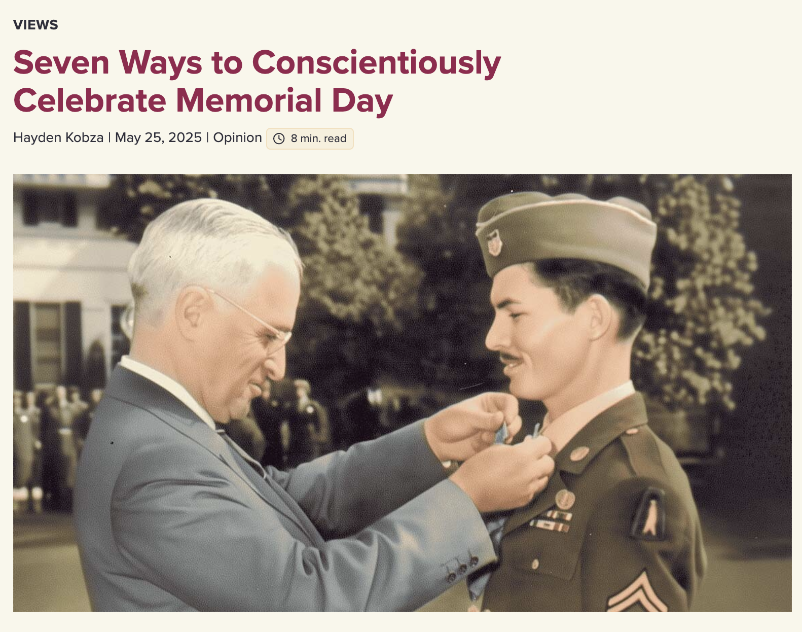 A man with silver hair, wearing glasses and a suit, awards a medal to a young woman in a military uniform with a hat, outdoor setting with trees and people in the background.