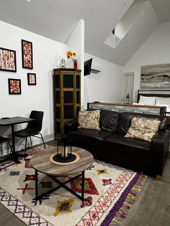 Open-plan chalet living with relaxed furnishings creates an inviting rainforest getaway just moments from Gallery Walk on Tamborine Mountain.