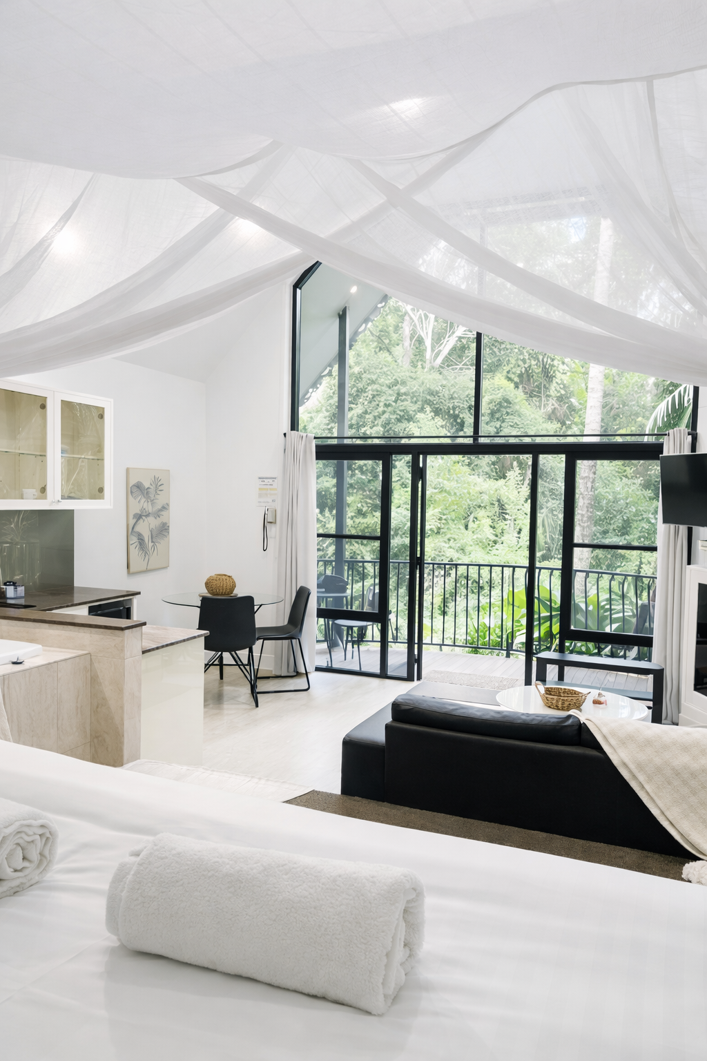 Wake up surrounded by nature in this rainforest getaway on Tamborine Mountain, with open living areas and balconies overlooking lush greenery.