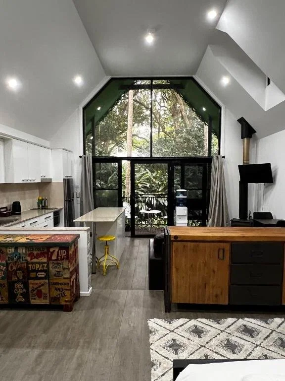 Settle into a warm, inviting living space at this Tamborine Mountain accommodation, complete with cosy furnishings and thoughtful details for a relaxed stay.