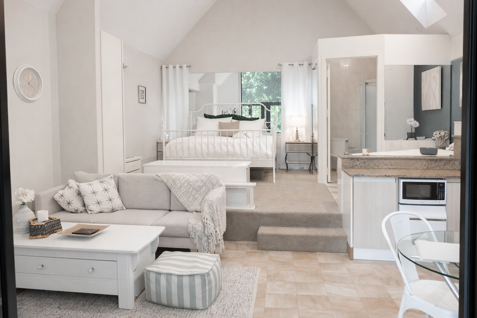 A relaxed rainforest getaway on Tamborine Mountain, featuring thoughtfully styled chalets with open living spaces, soft neutral tones and everything needed for a comfortable stay.