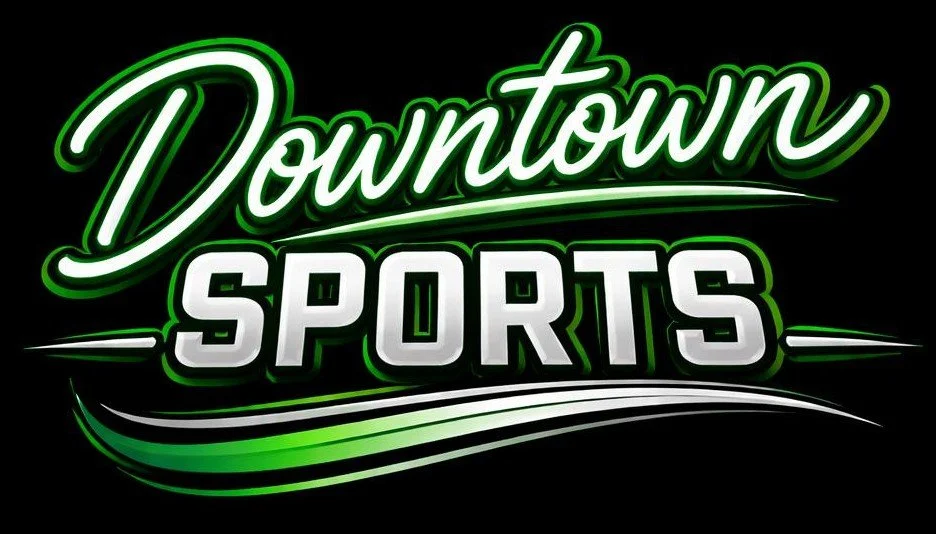 Neon sign reading 'Downtown Sports' in green and white colors.