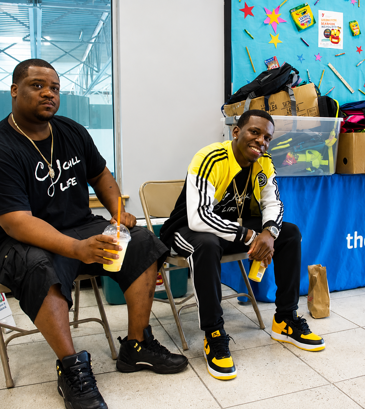 jamal and friend sitting smile.png