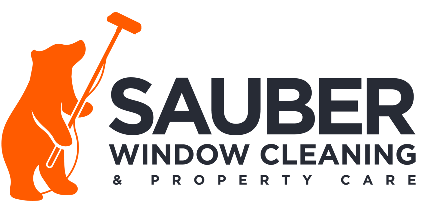logo for Sauber Window Cleaning & Property Care featuring an orange bear holding a squeegee.