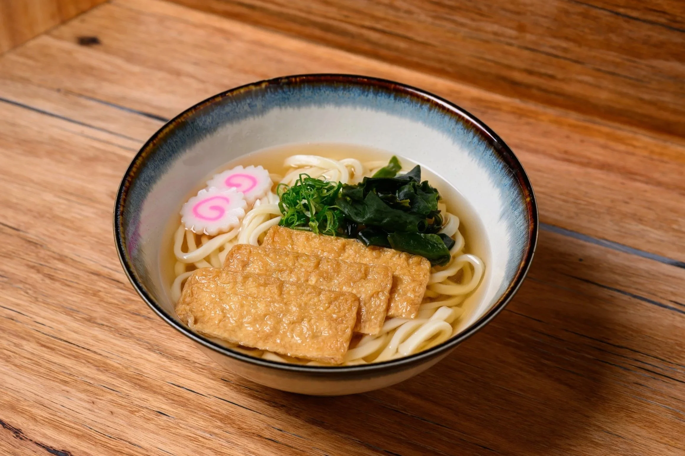 Kitsune Udon – Sweet-simmered inari tofu (aburaage) on hot udon in dashi broth. (Gentle, slightly sweet, very Japanese.)
