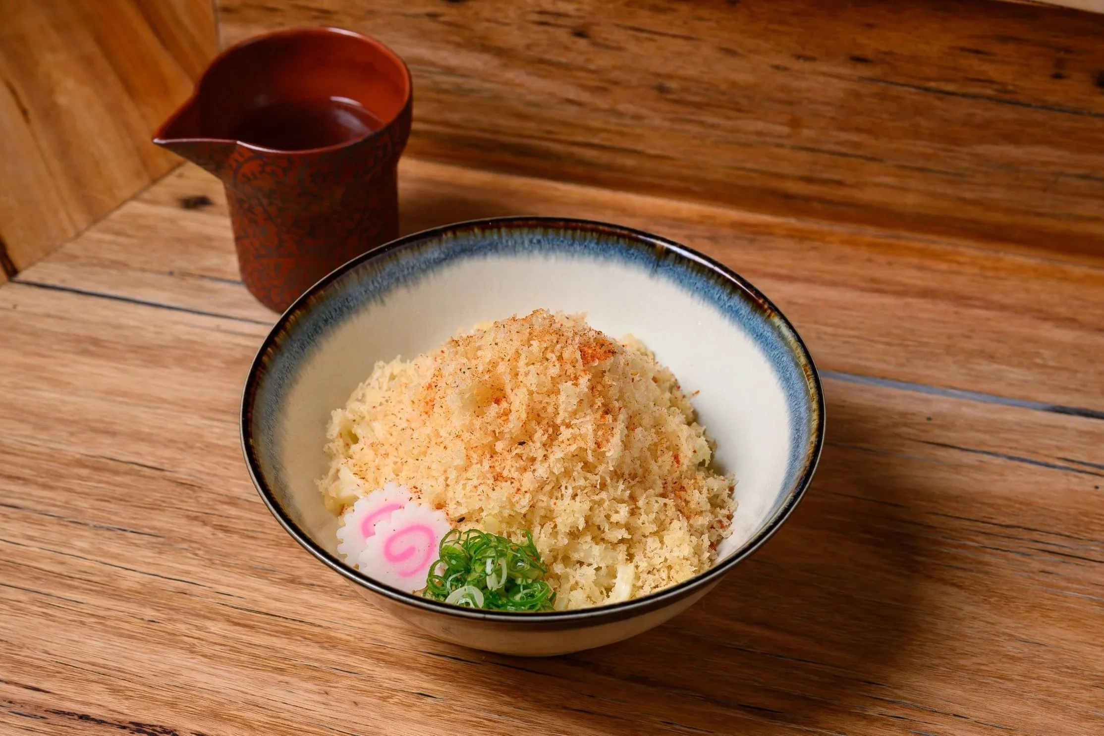 Tanuki Udon – A comforting bowl topped with tempura crumbs (tenkasu) and spring onion. (House classic—great if you like aroma and texture.)