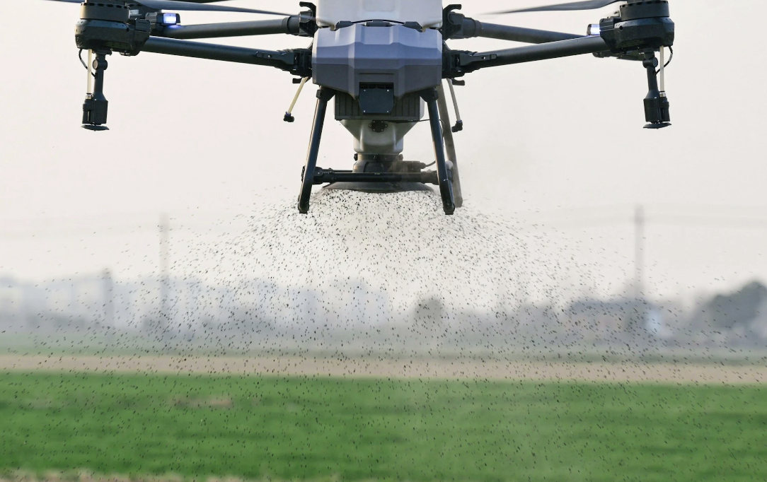 Agricultural drone seeding a field
