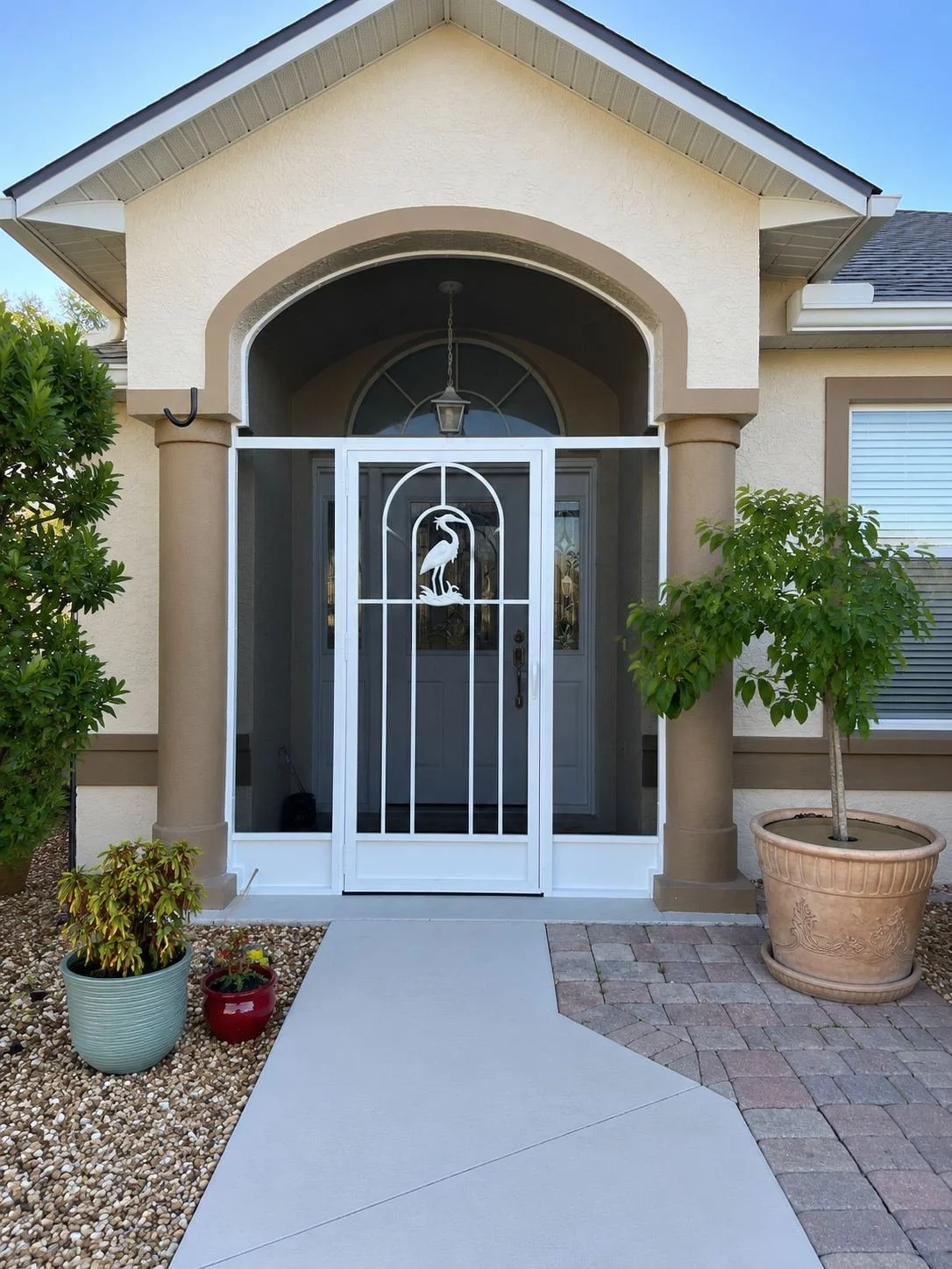 Charming suburban entryway with greenery.jpg