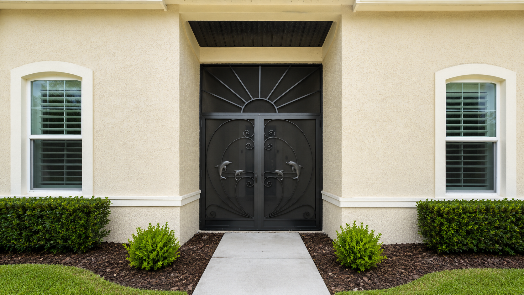 Front view of a house entrance with a front enclosure.