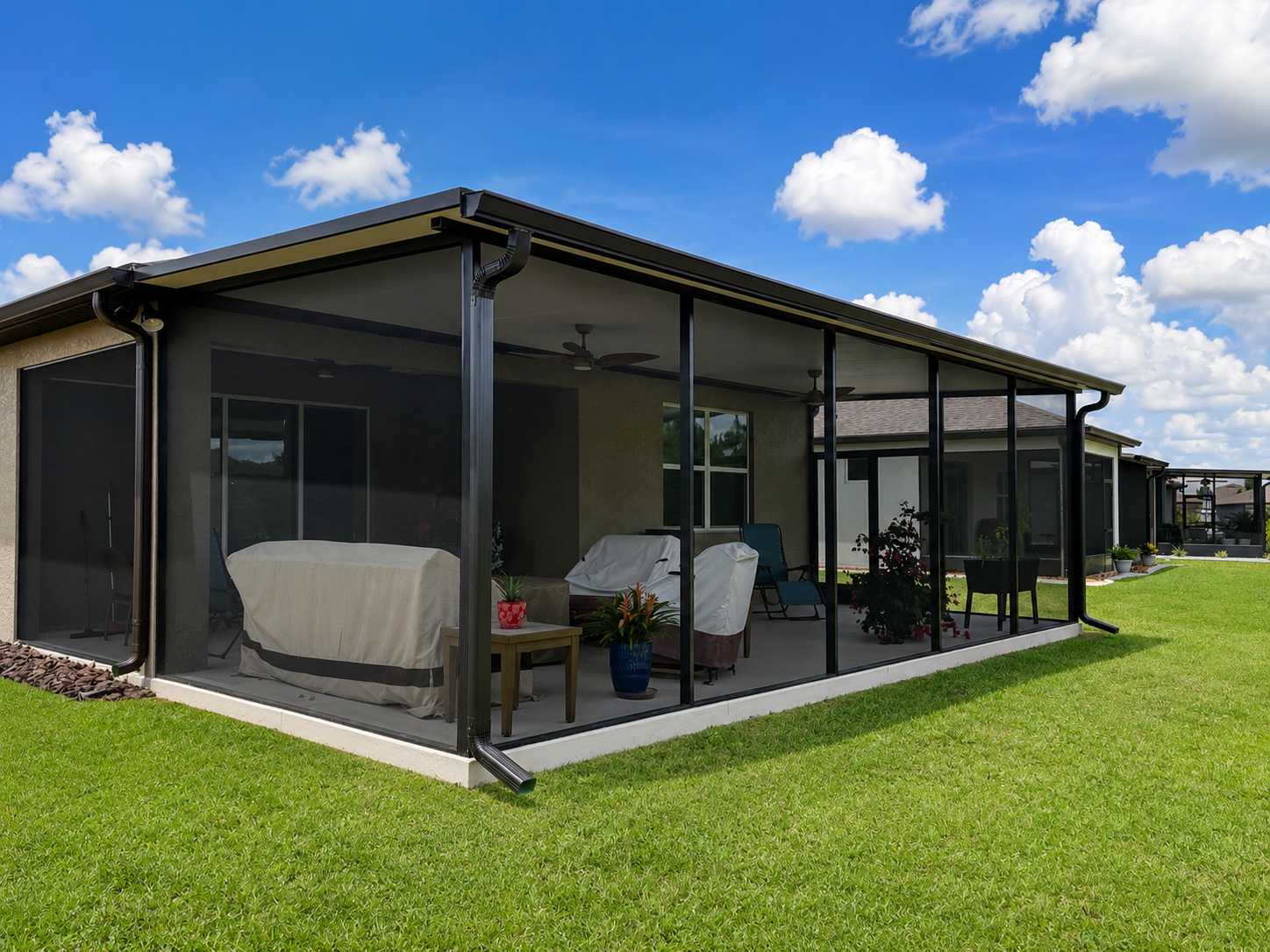 Modern screened porch with sunny backdrop.png