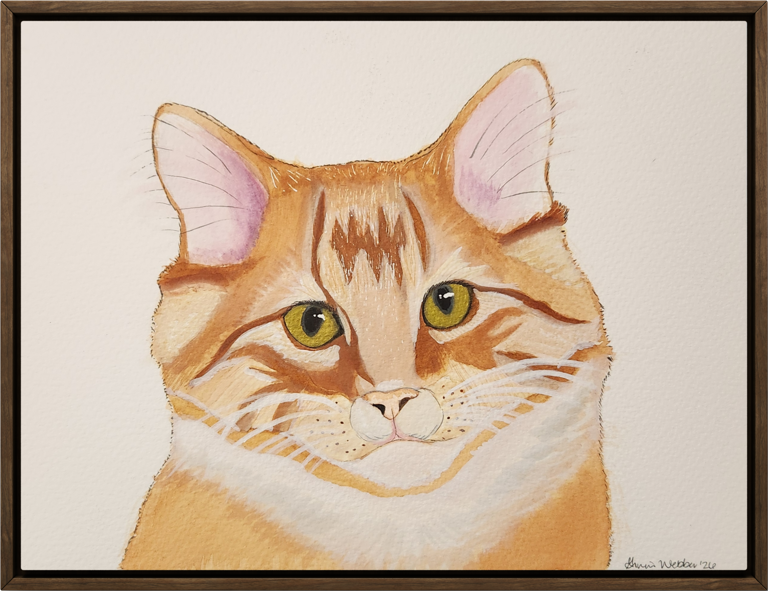 Watercolor painting of a golden-brown tabby cat with green eyes, facing forward, with pink inside its ears, on a white background.