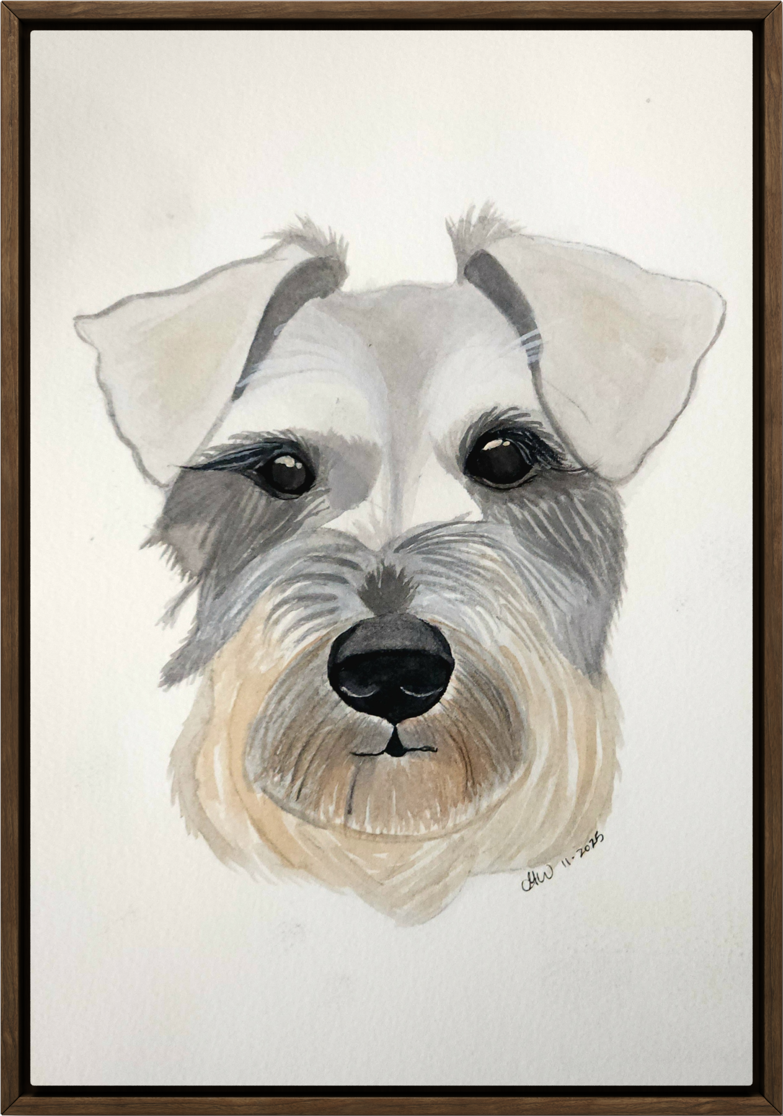 Watercolor painting of a dog's face, a schnauzer, with gray, black, and tan fur, framed in a dark brown wooden frame.